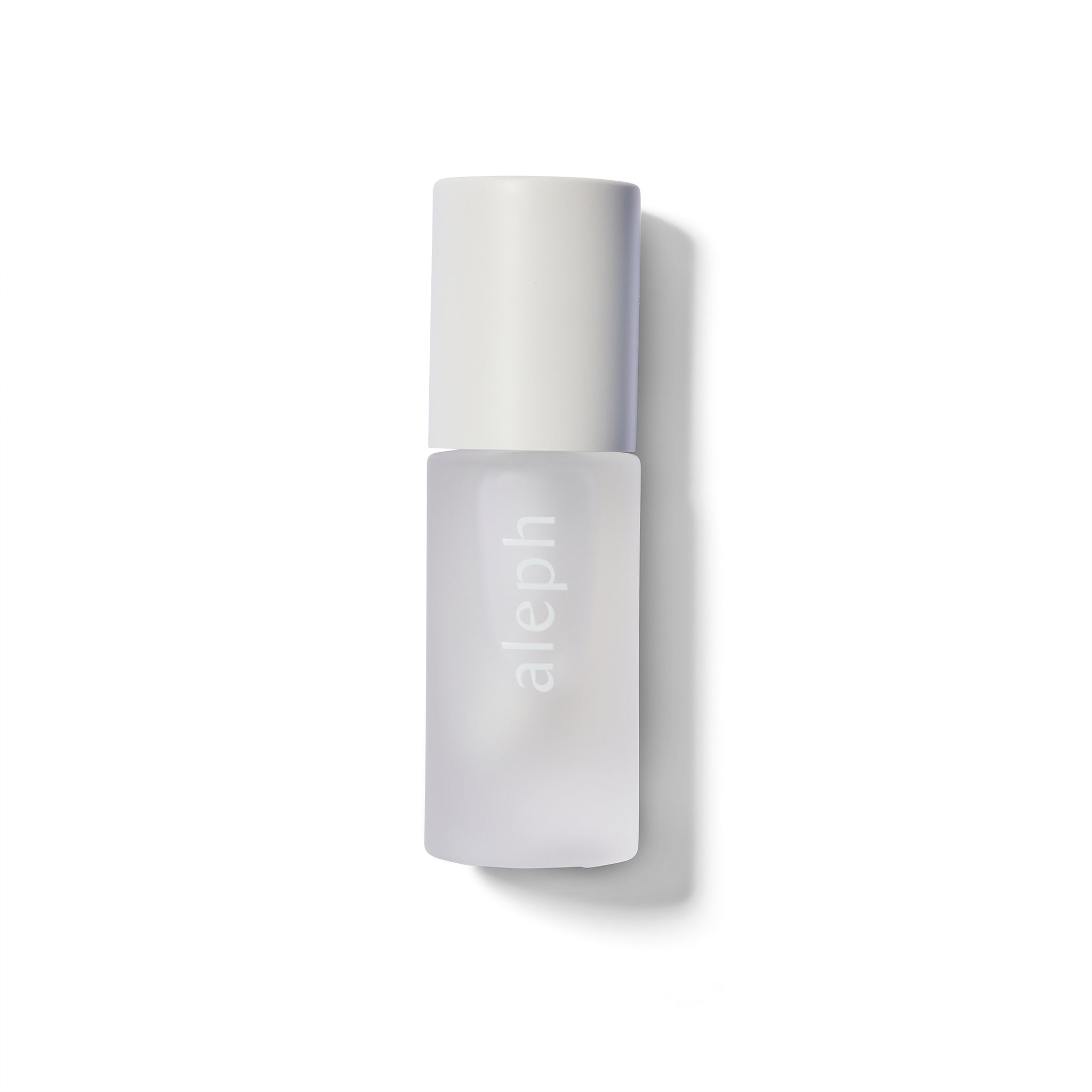 White cylindrical lip gloss bottle with 'aleph' branding on a white background.
