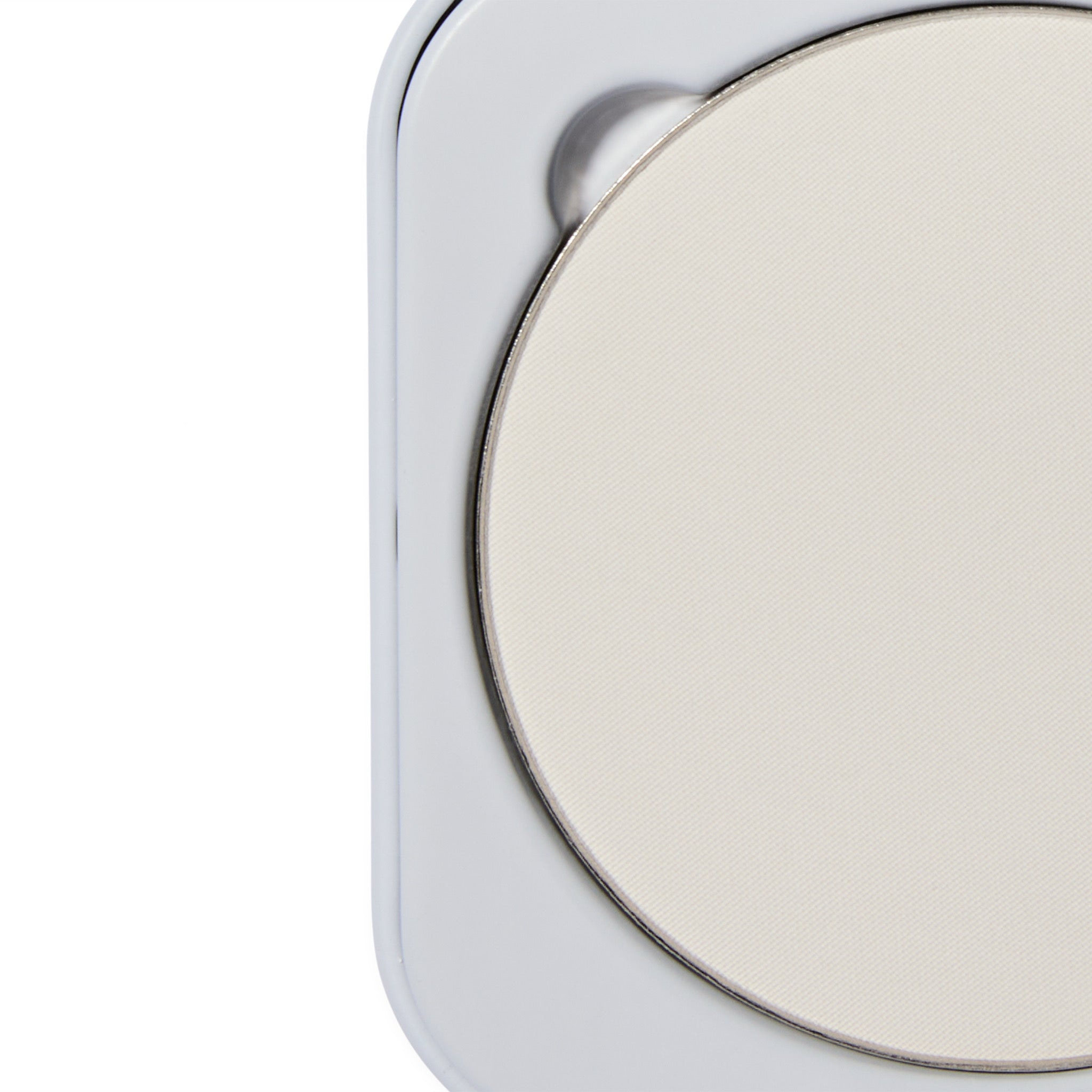 Close up of the texture of a white pressed powder in a compact case on a white background.