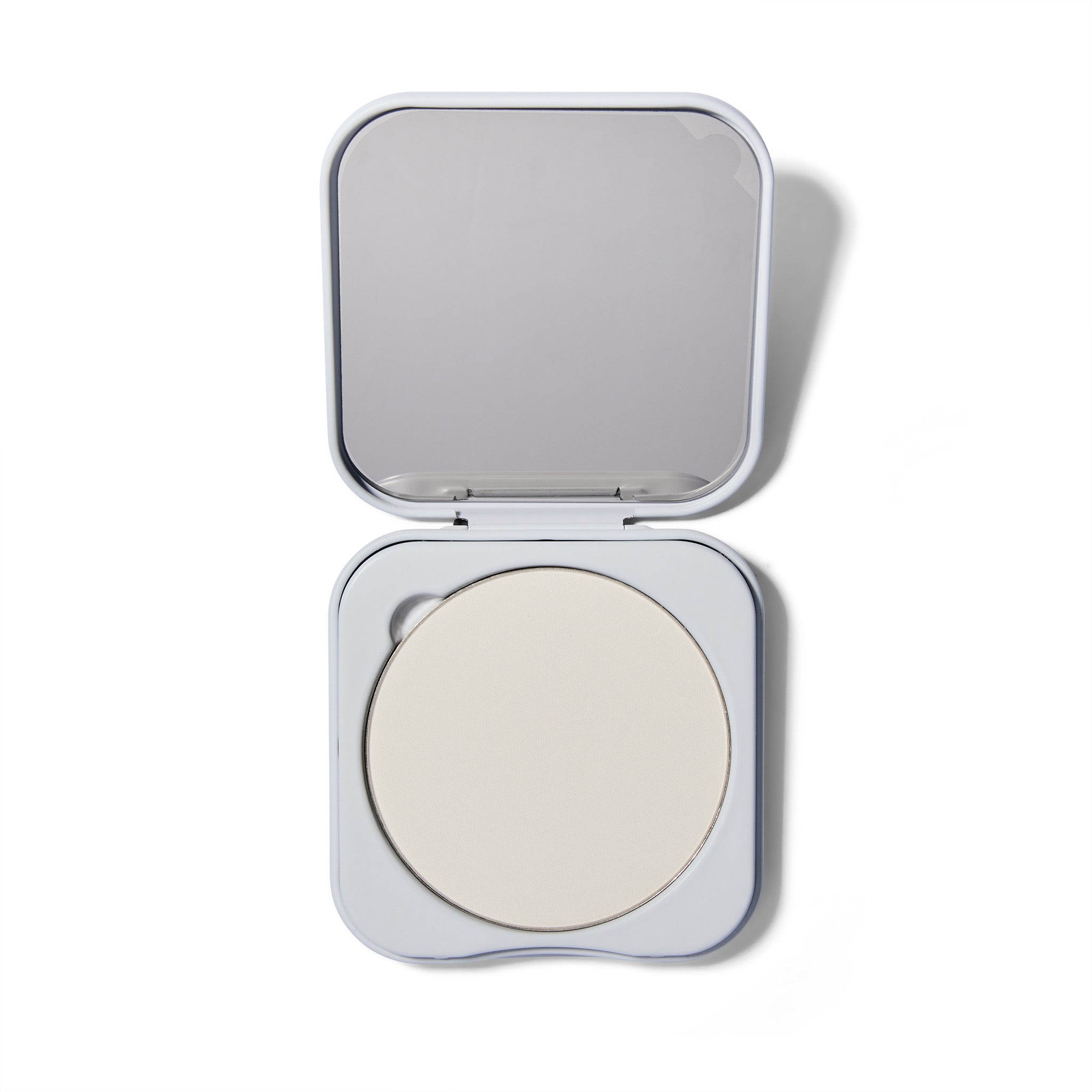 Compact powder in a white case on a white background