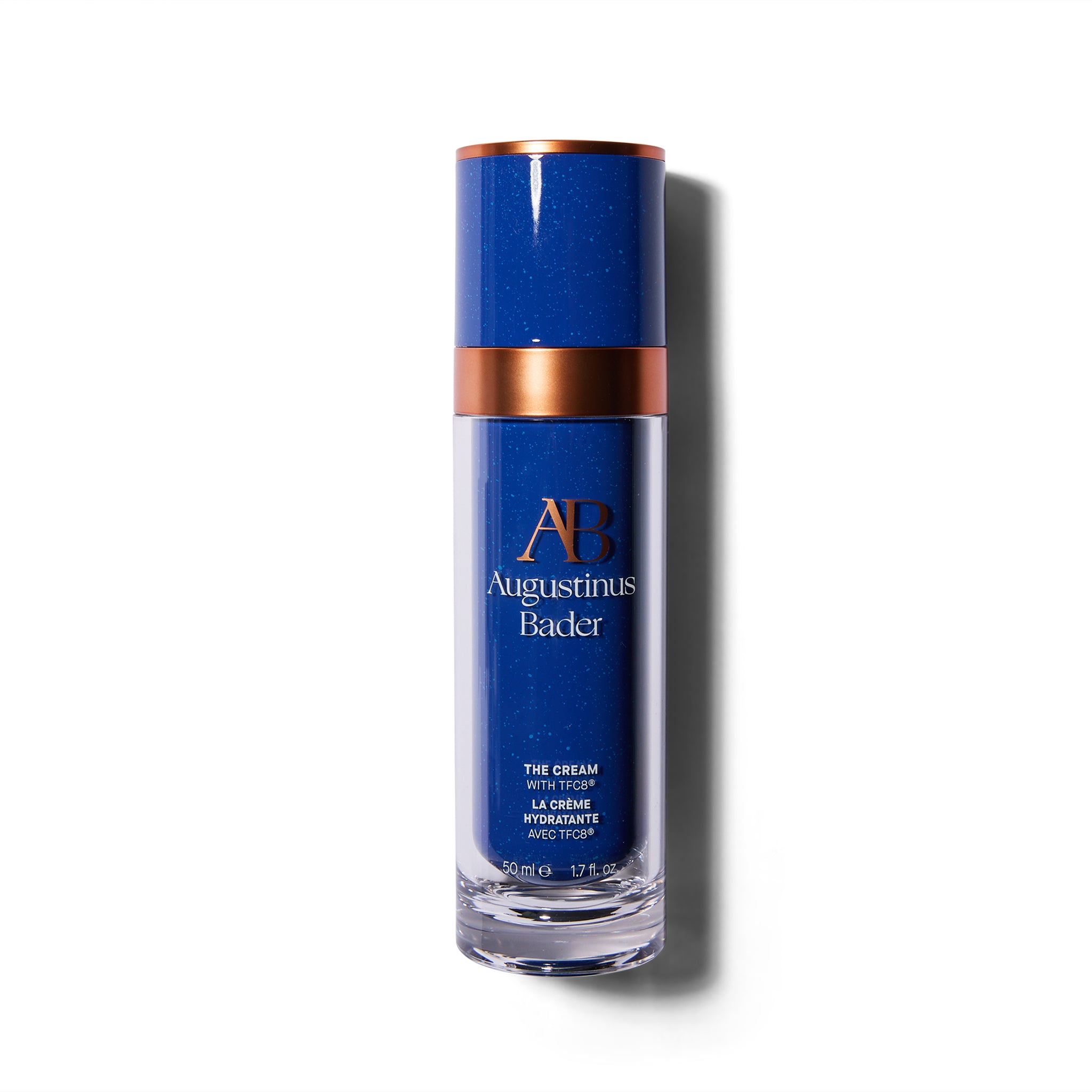 Tall blue bottle with metallic orange accents. The font is orange and white.