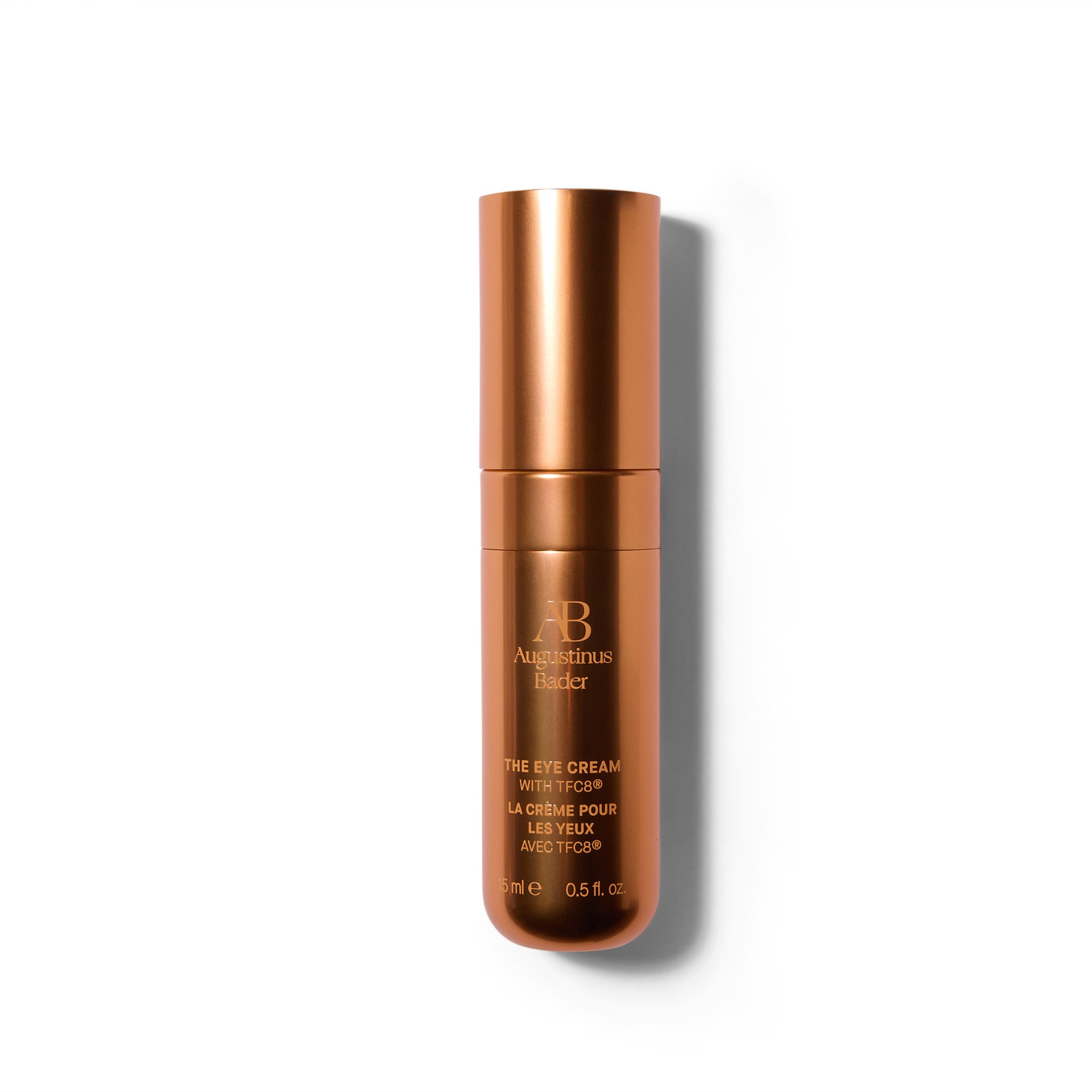 A matte metallic deep orange bottle with the cap on. The font is a similar orange shade.