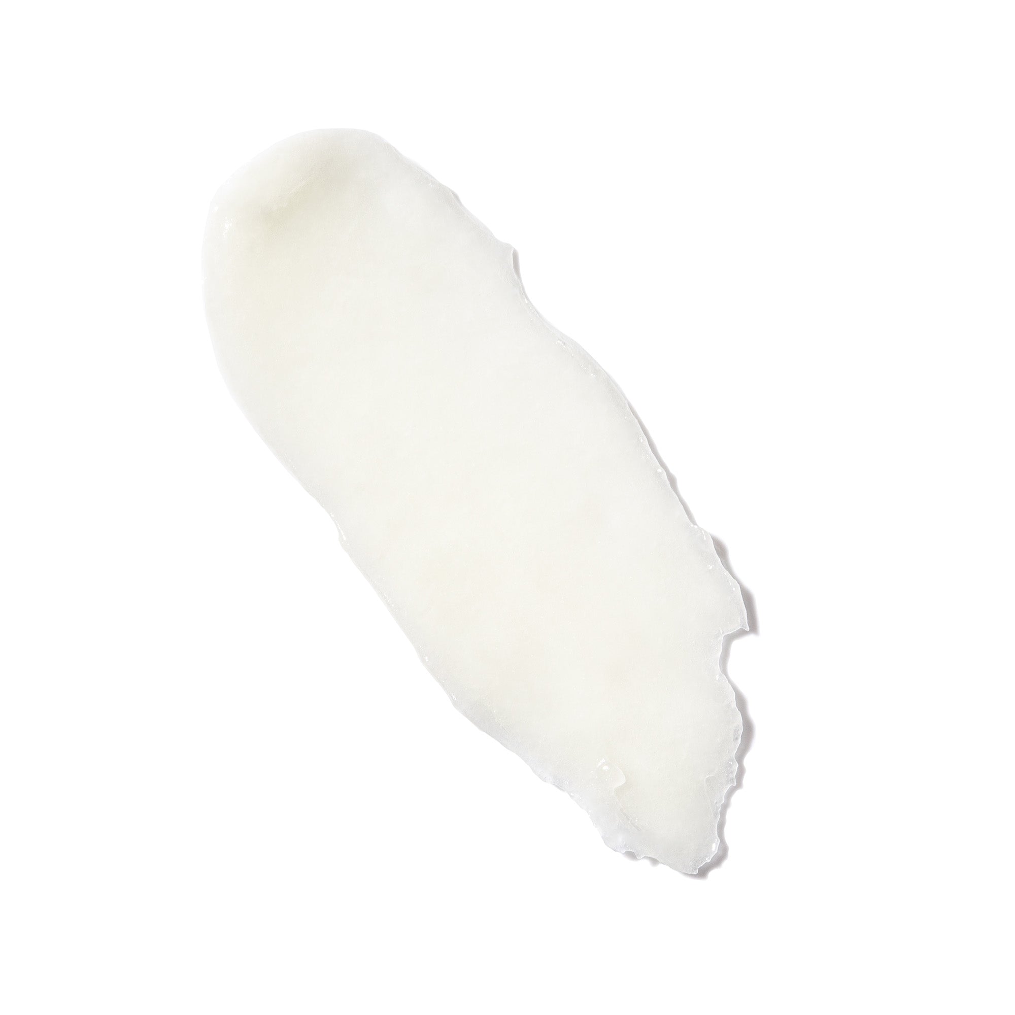 Swatch of clear, waxy lip balm on a white background