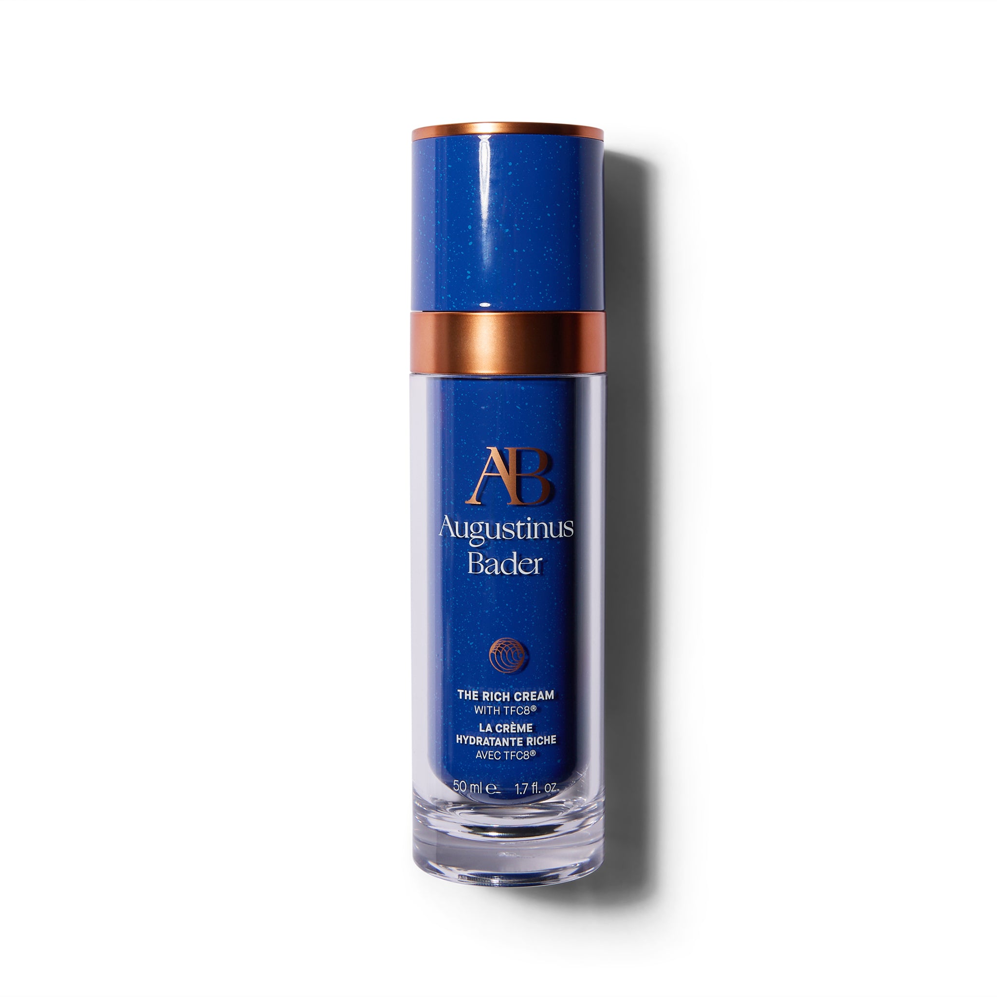 Tall blue bottle with metallic orange accents. The font is orange and white.