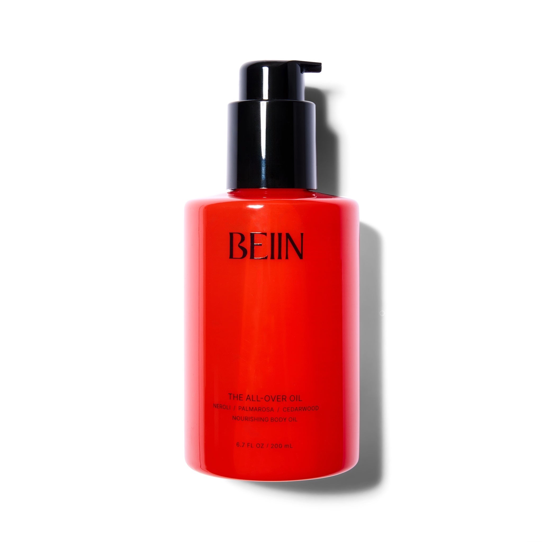 Red bottle with black pump labeled 'BEIIN' on a white background