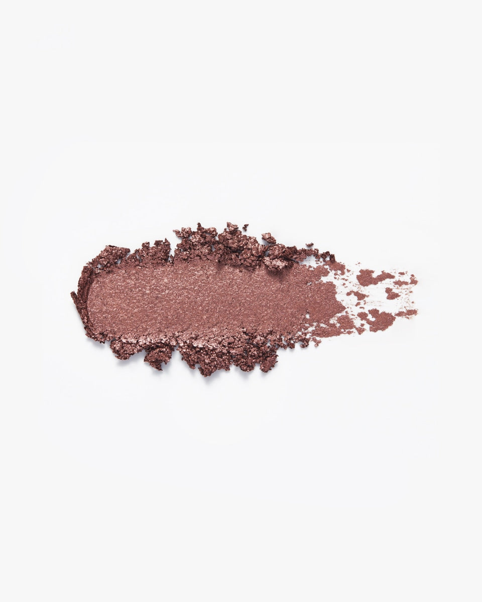 A swatch of shimmery bronze eyeshadow.