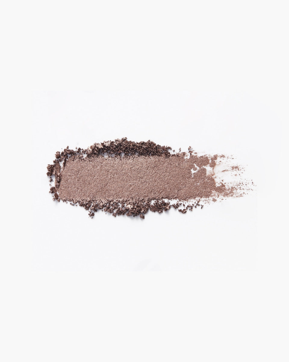 A swatch of shimmery pewter eyeshadow.