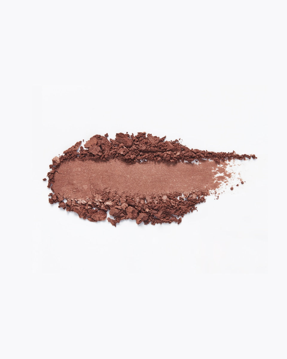 A swatch of nutmeg colored eyeshadow.