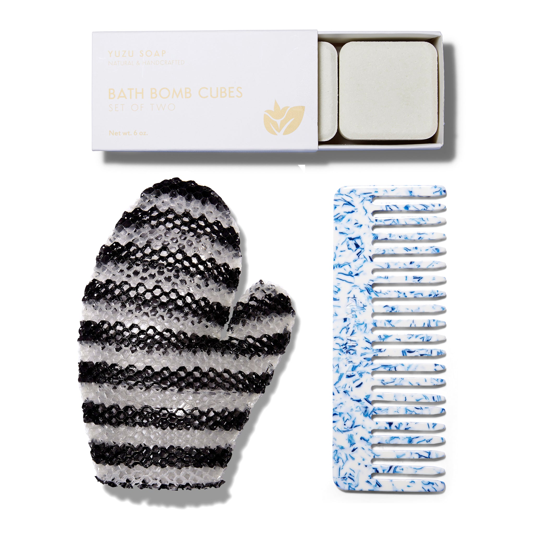 The grouping for the Bath Lovers Set. This includes the Stimulite Bath Mitt, the Yuzu Soap Bath Bomb Cubes and the blue toile comb from Machete.