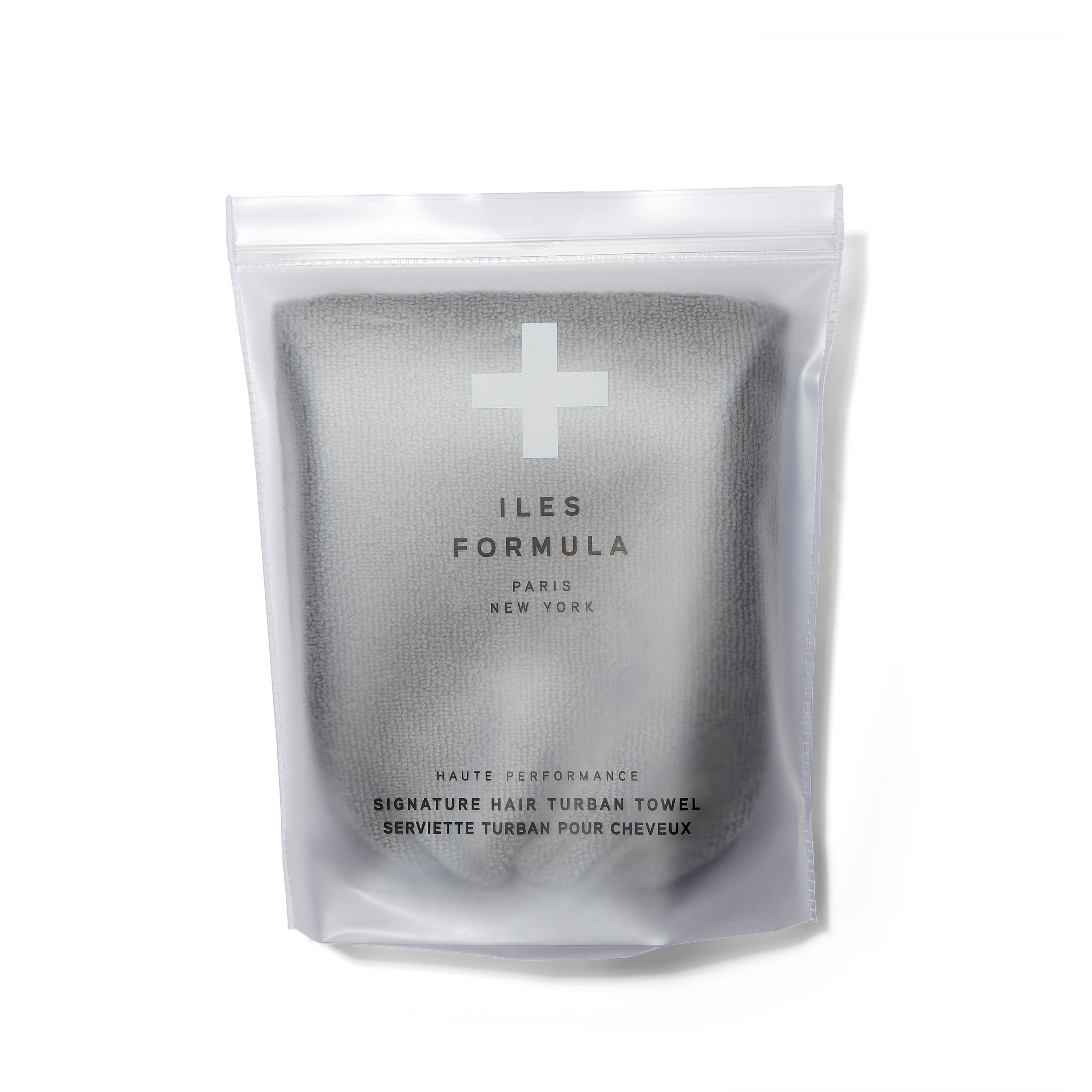 Iles Formula Signature Hair Turban Towel in grey in it's packaging.