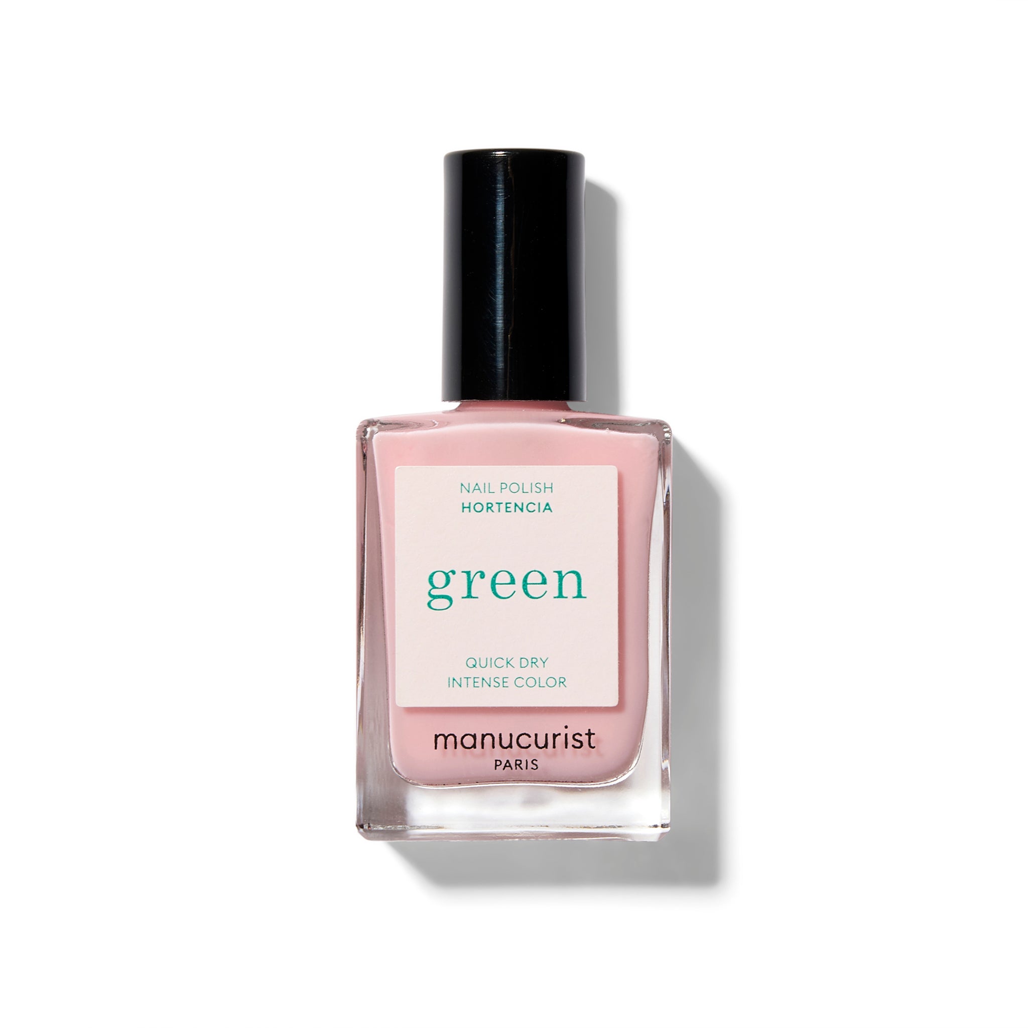 pale pink nail polish with a white label with green text.