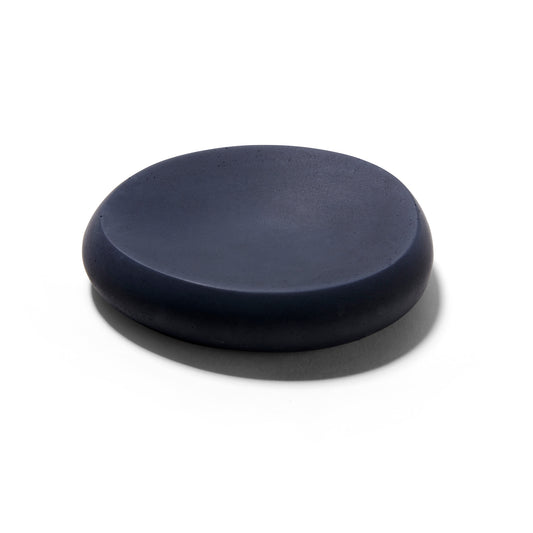 The Mitmo concrete soap dish is an oval shaped matte black concave dish. 