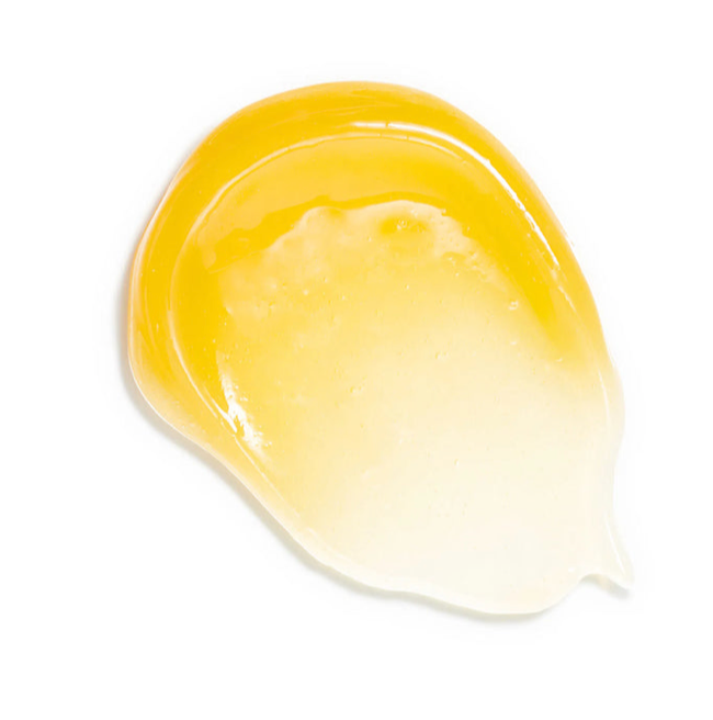A rich yellow swatch of the balm on a white background.