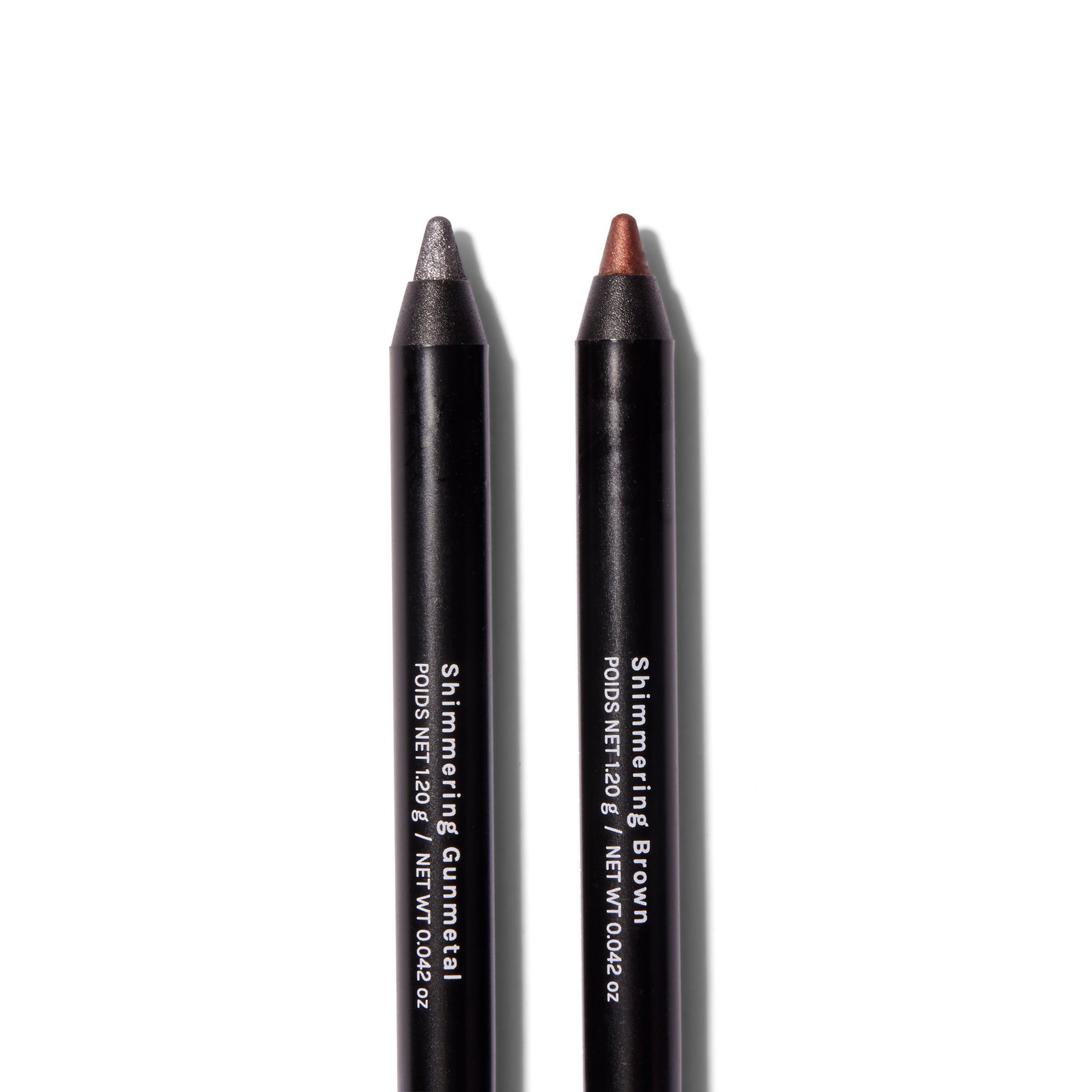 Close up of Roen Eyeline Define Eyeliners in Shimmering Gunmetal and Shimmering Brown. 