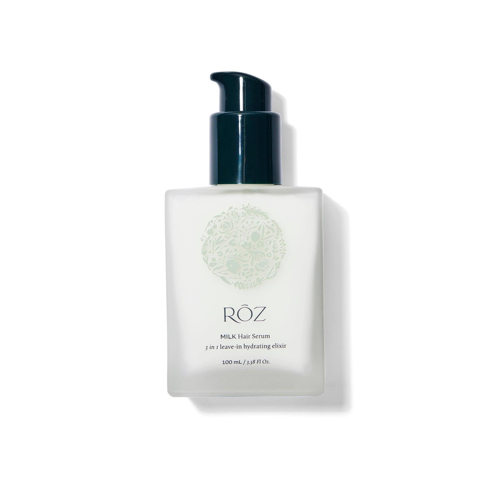 Front view of the ROZ Milk Serum. The bottle is glass with deep green pump. The cap is off.