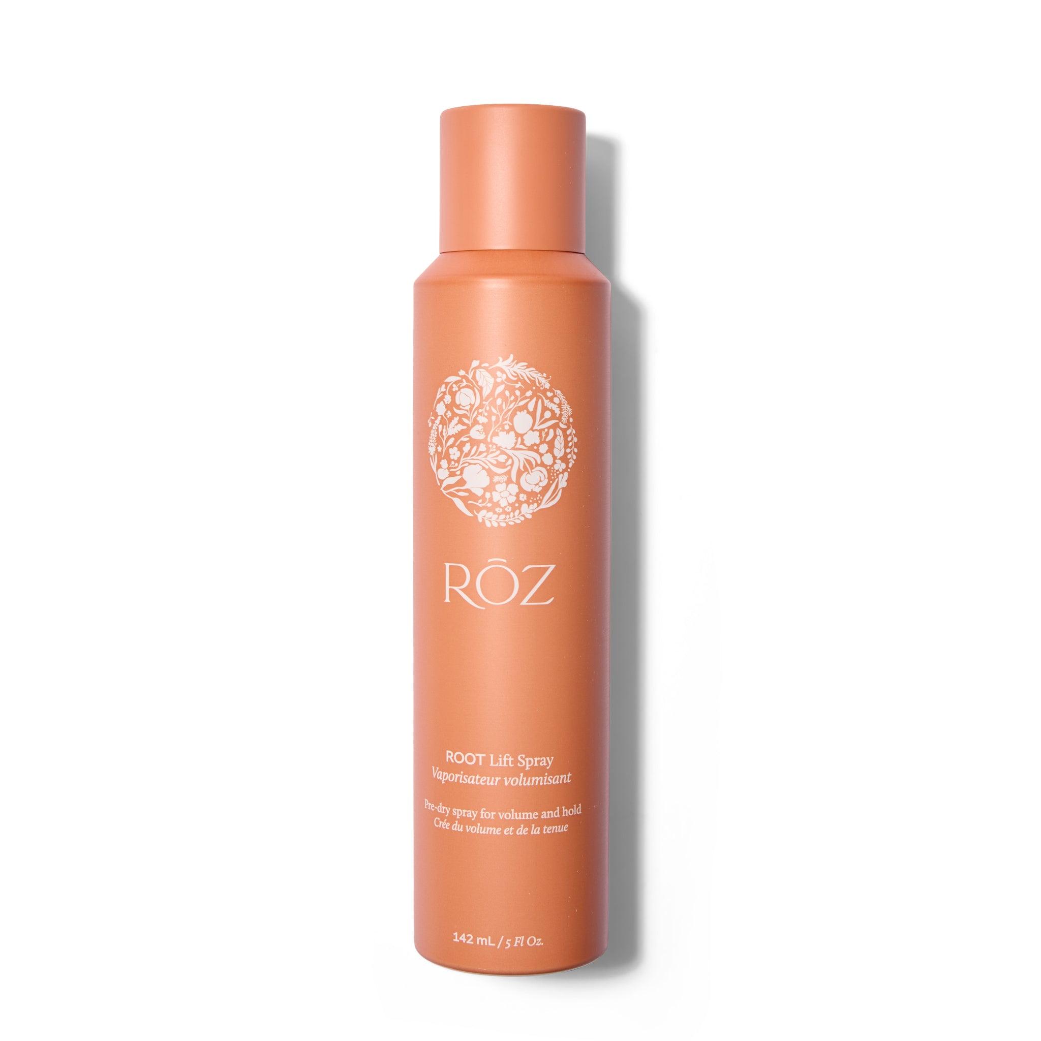A tall thin terracotta colored metal bottle with white text and logo. The cap is on.