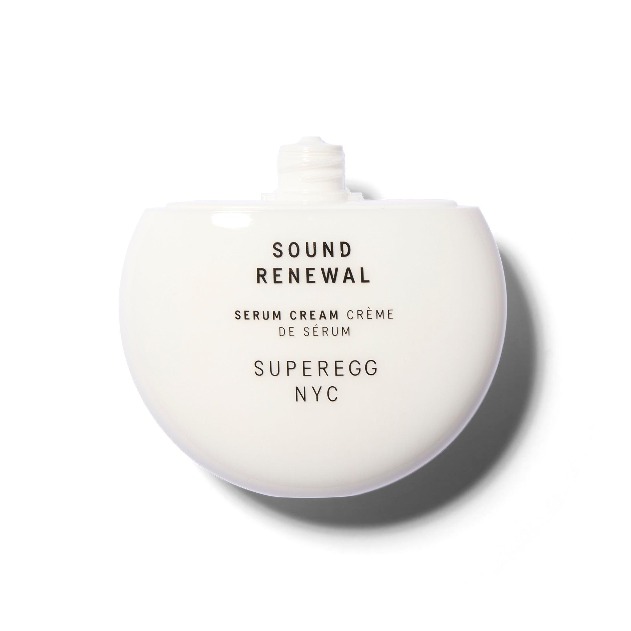A white round component with the cap off. The text is black.