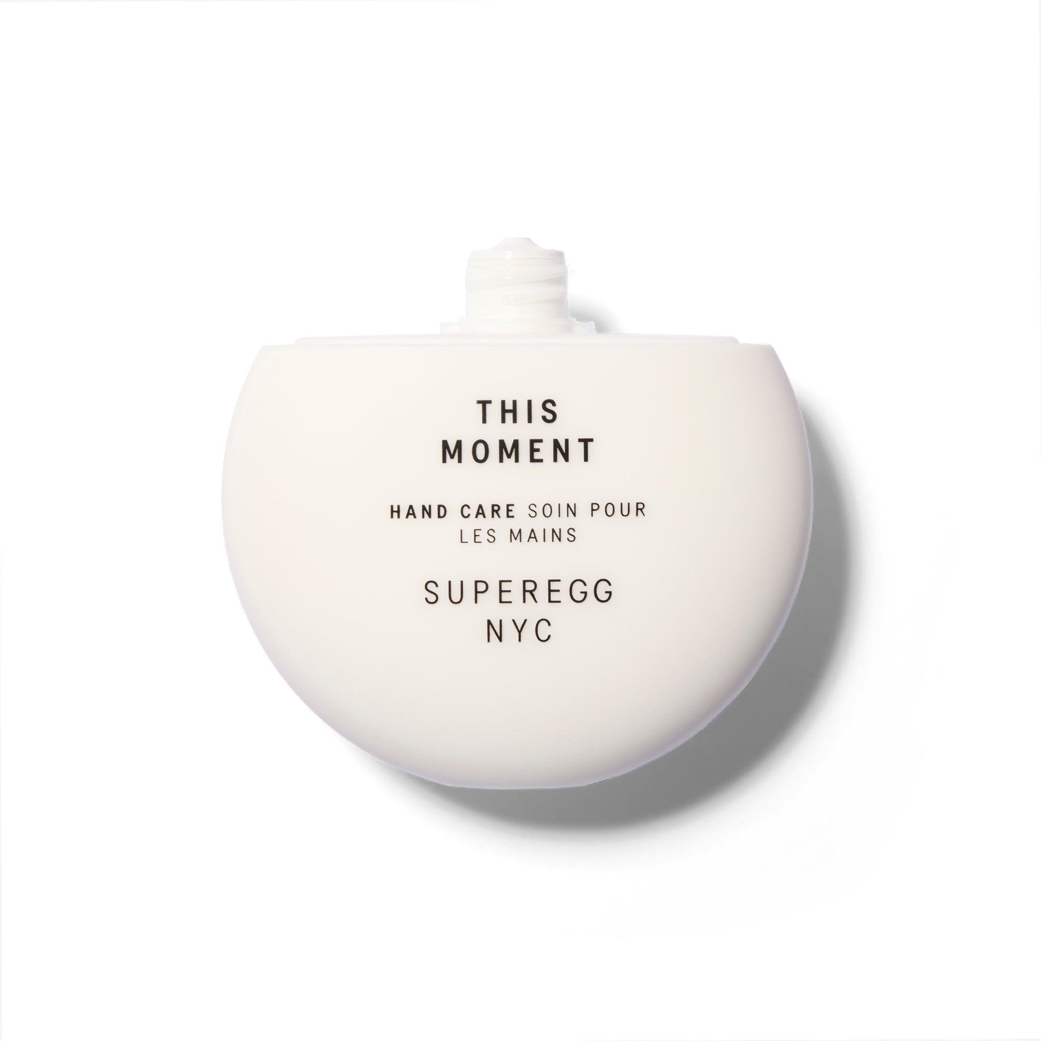 A white round component with the cap off. The text is black.