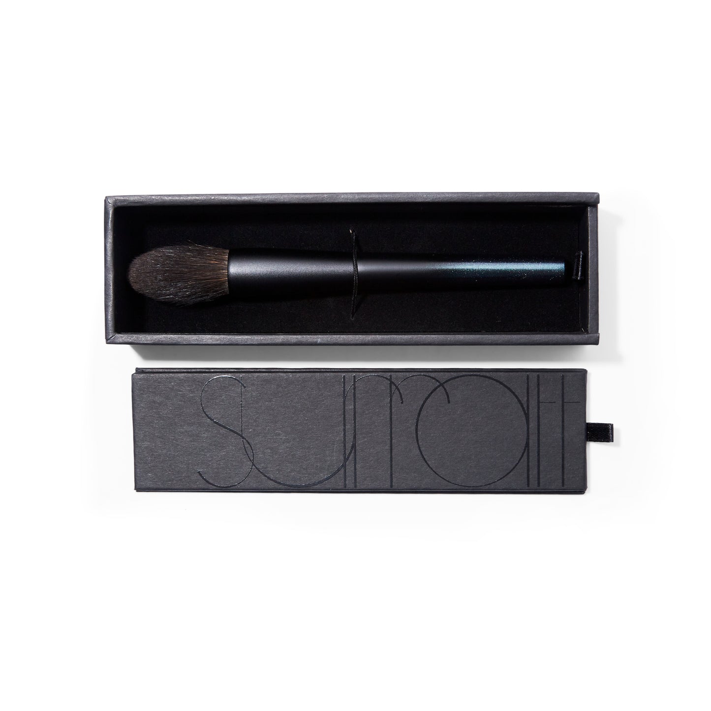 Surratt Artistique black handled makeup brush for blush or highlighter with natural bristles. Brush is tapered to a soft point. Brush is in a sturdy black box with velvet lining.