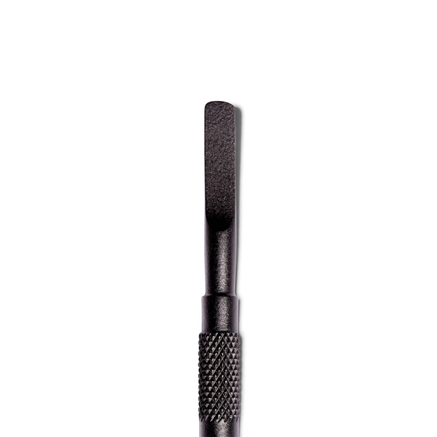 Close up of The Push Back cuticle pusher from ten over ten. This side is rounded on the edges and a matte black.