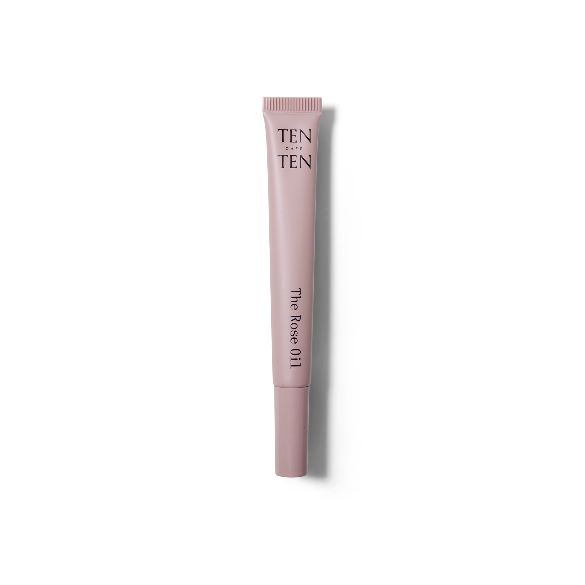 Full view of The Rose Oil from ten over ten. The tube is a dusty pink and the cap is on.
