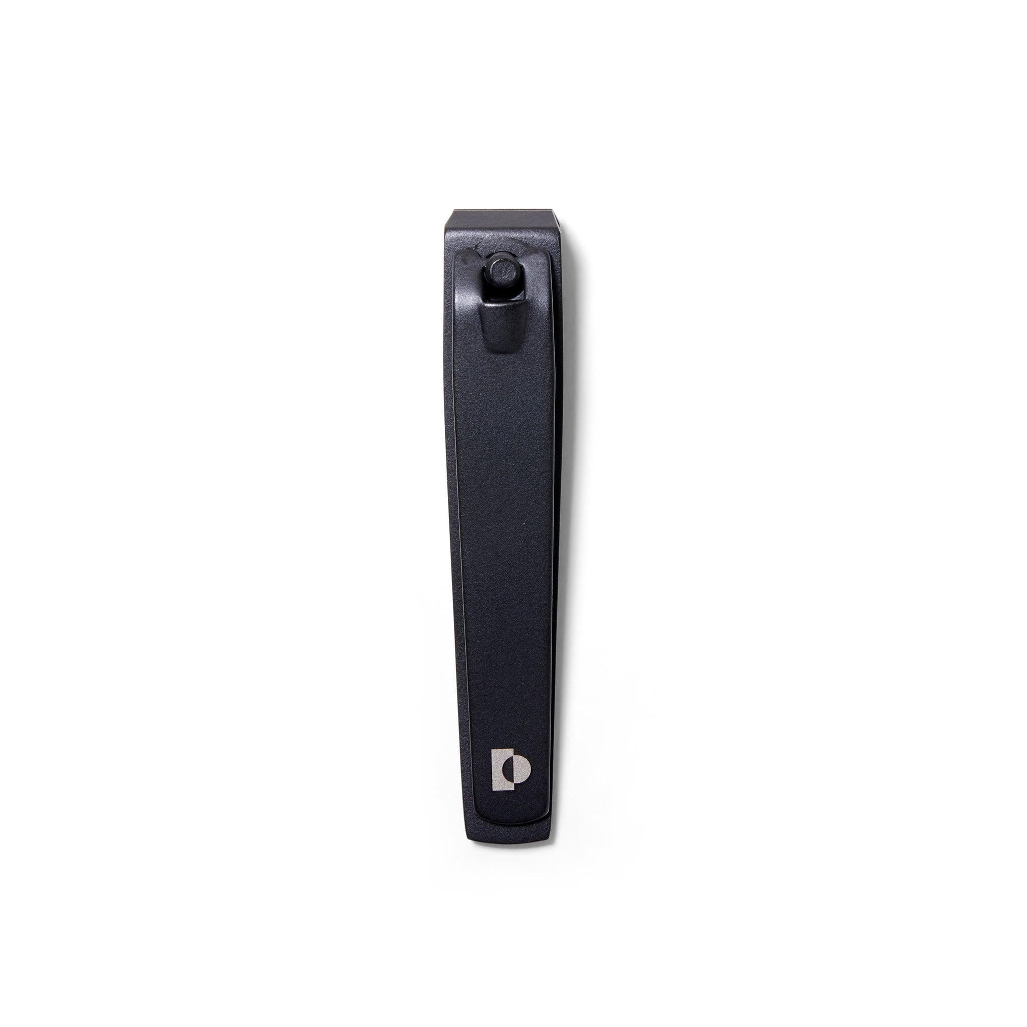Top view  showing The Big Clip, the matte black metal large nail clippers from ten over ten. The clippers are closed.