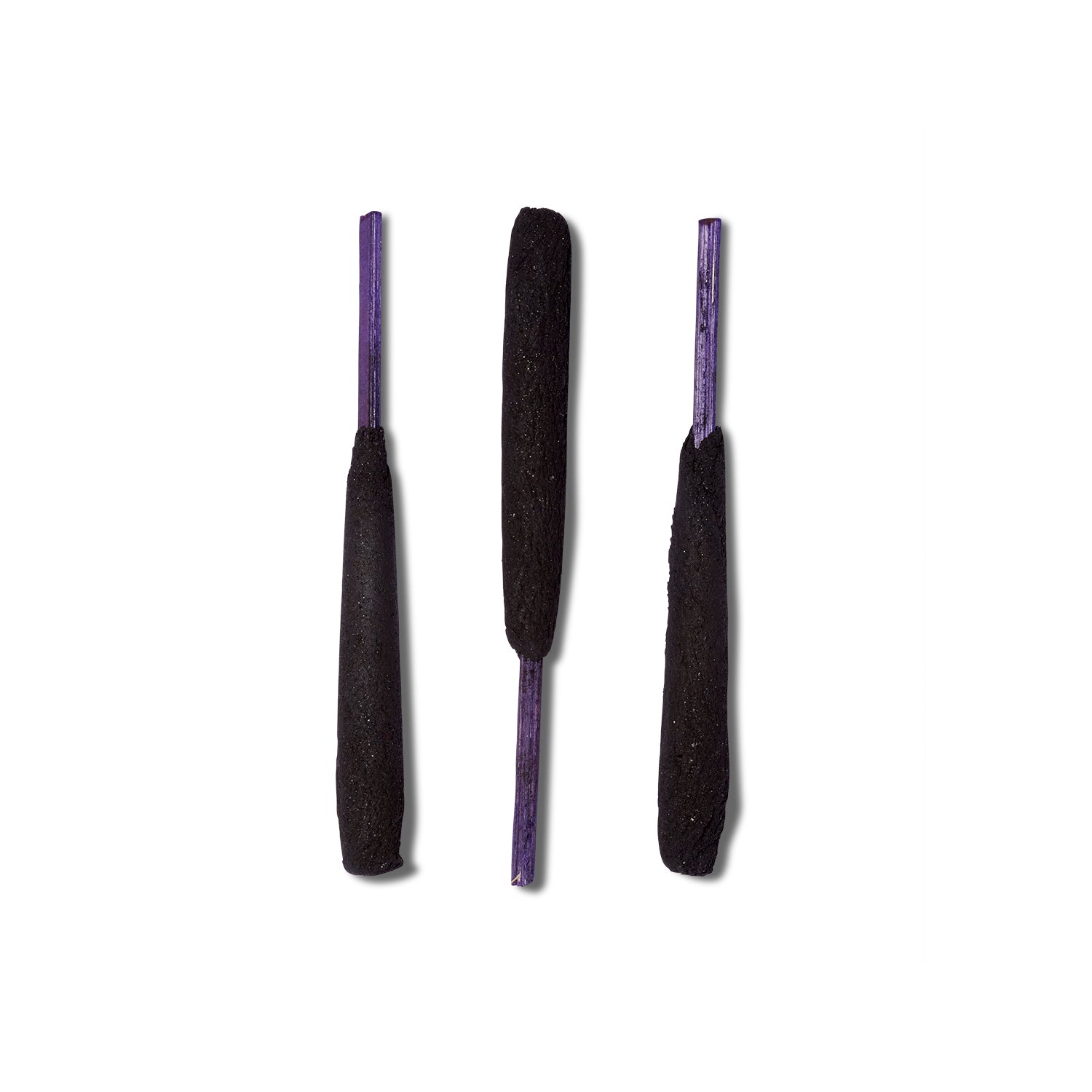 Three sticks of the Holy Smoke incense from Zen Bunni. The incense is thick and a deep black color with purple wooden sticks.