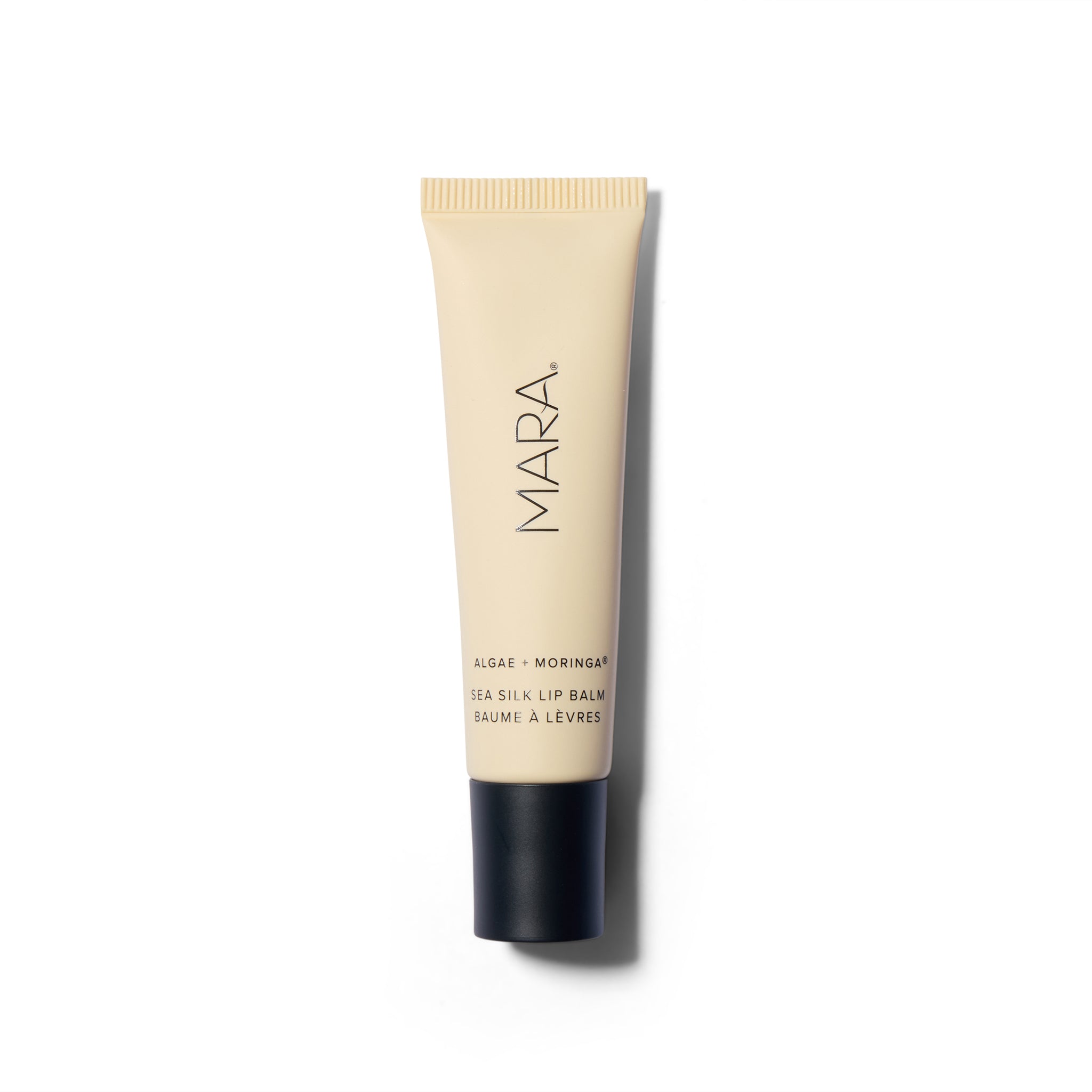 Beige tube with black text and a black cap.