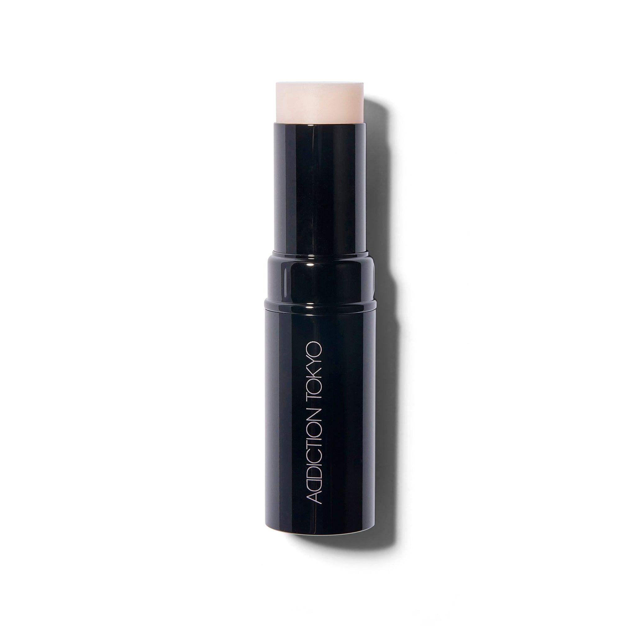 Full view of The Glow Stick from Addiction Tokyo. The shade is Feel The Heat, See The Light and the translucent cream highlighter is wound up out of the tube to show the product.