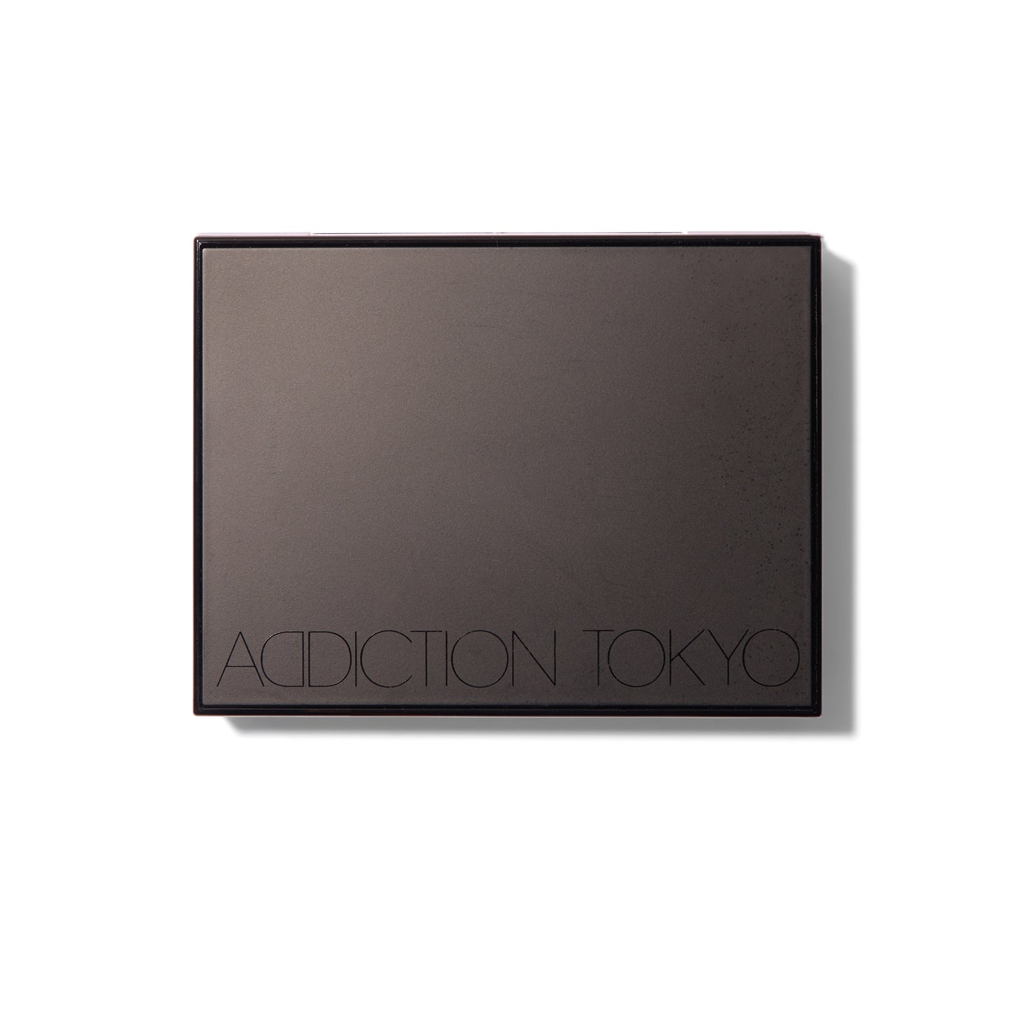 The black Compact Case II, closed, with Addiction Tokyo logo on the front.