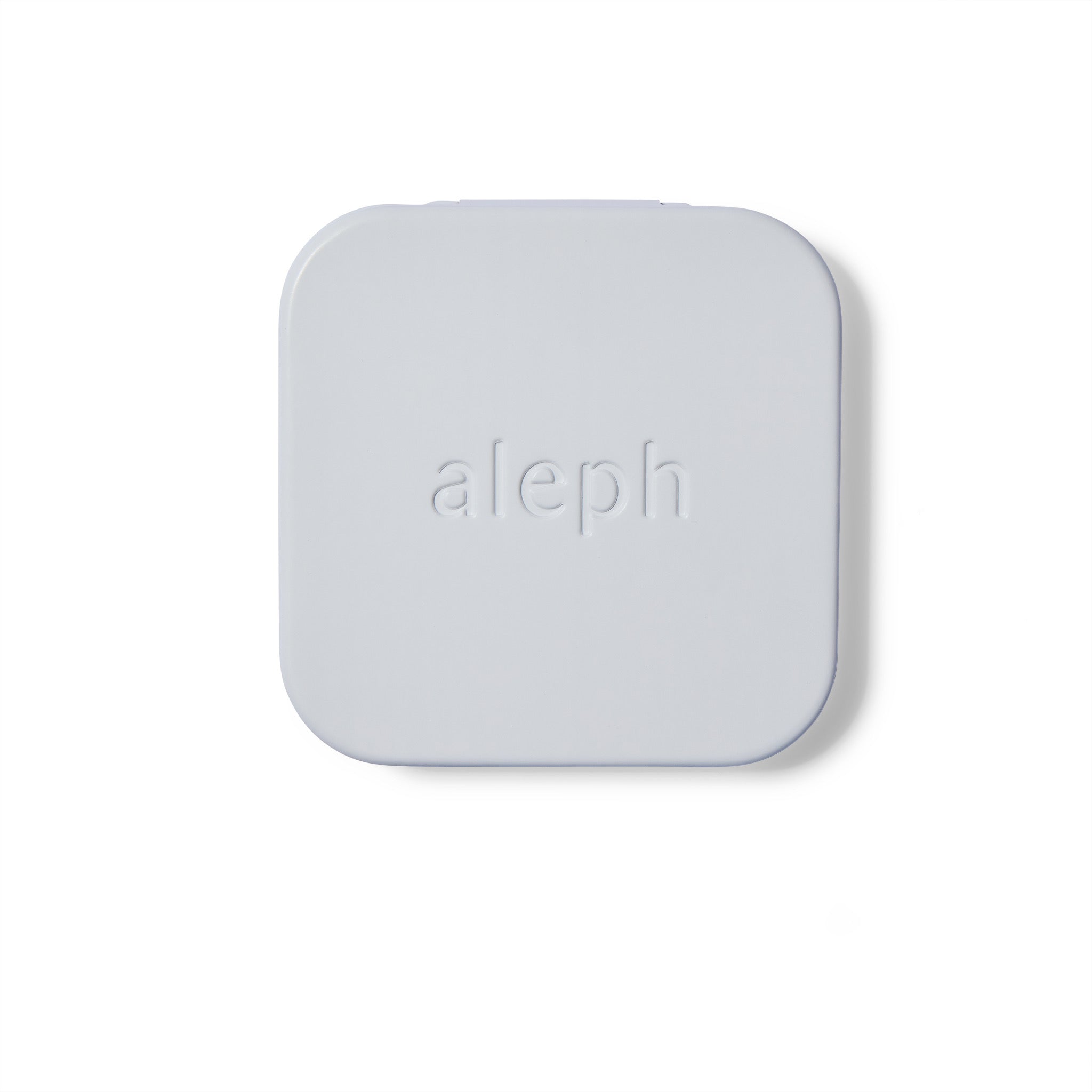White metal compact with 'aleph' branding on a white background
