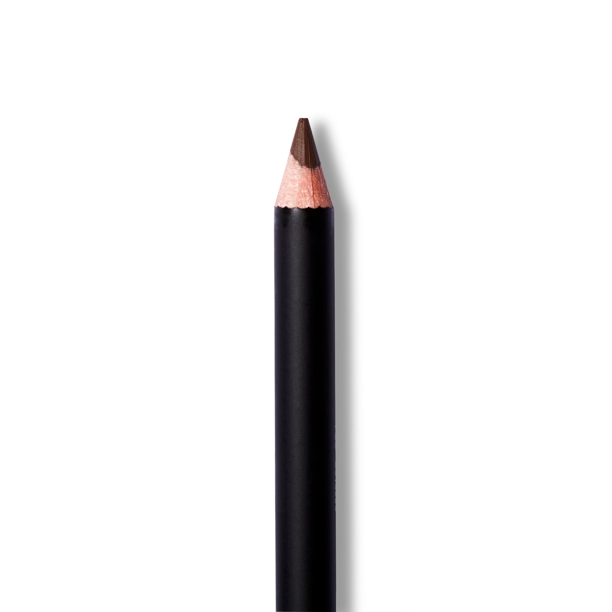 A close up of the Antonym brown eyeliner with the cap off. The eyeliner pencil is sharp.