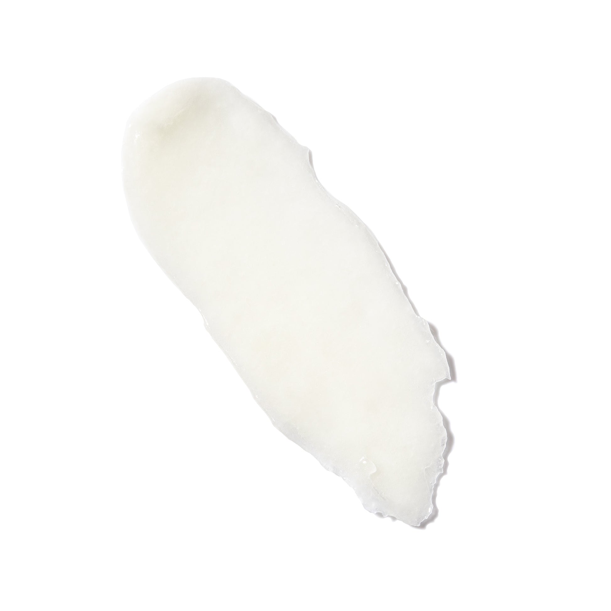 Swatch of clear, waxy lip balm on a white background 