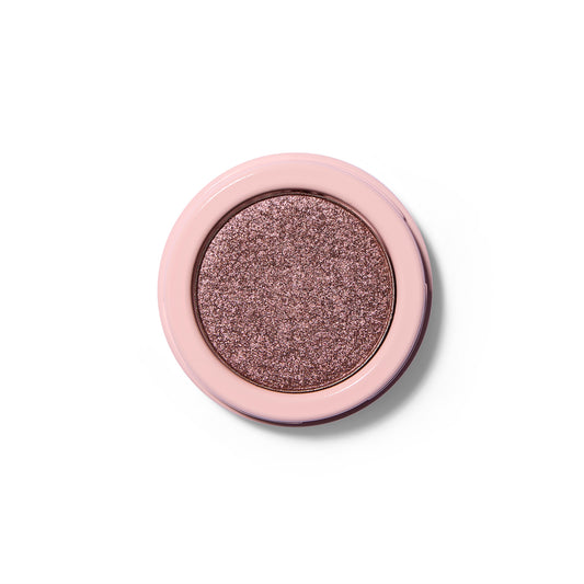 A shimmery bronze pressed eyeshadow in a pink component.