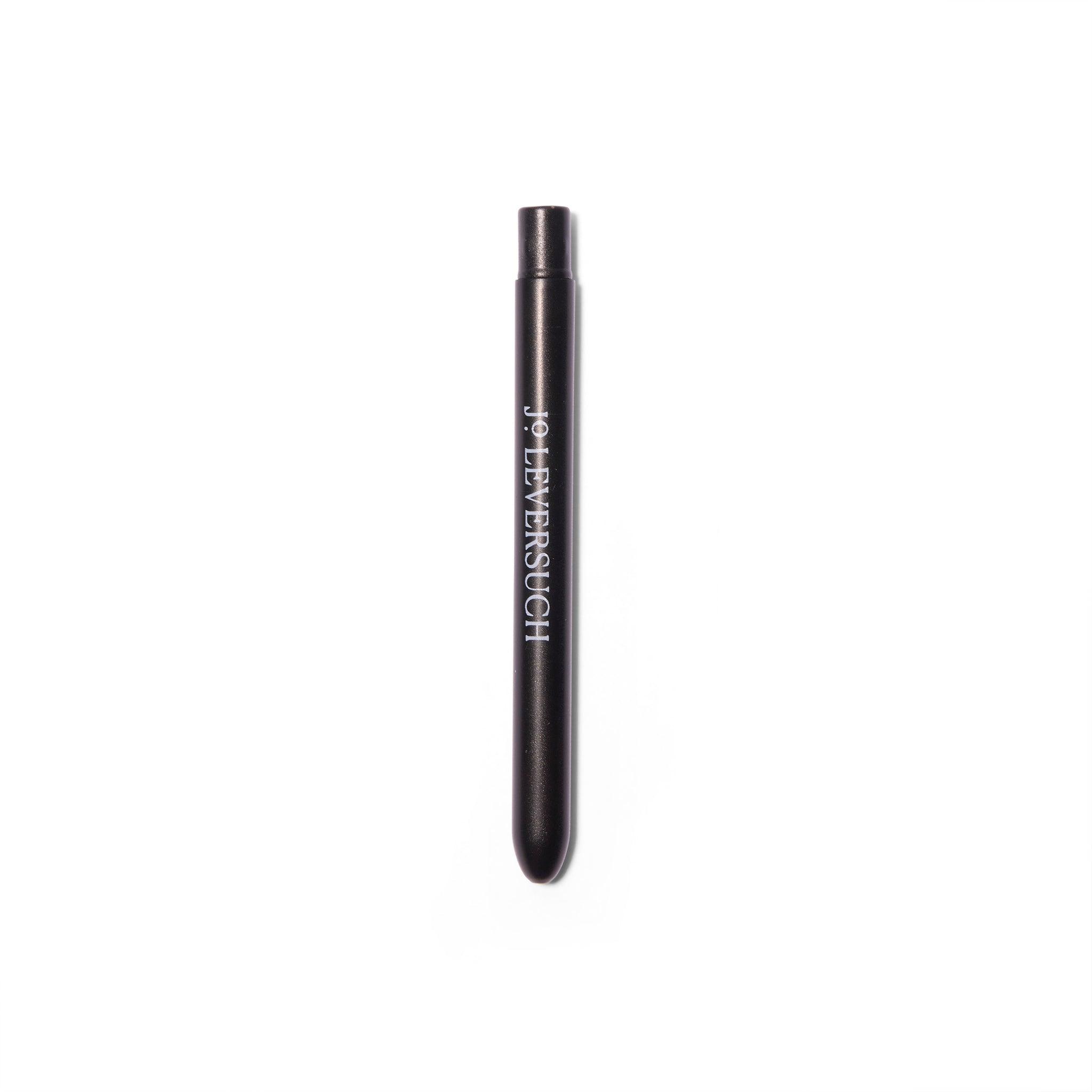 View of the Jo Leversuch Untitled No. 1 Fine Application Brush. The brush head is inserted into the hollow metal tube, protecting the brush. 