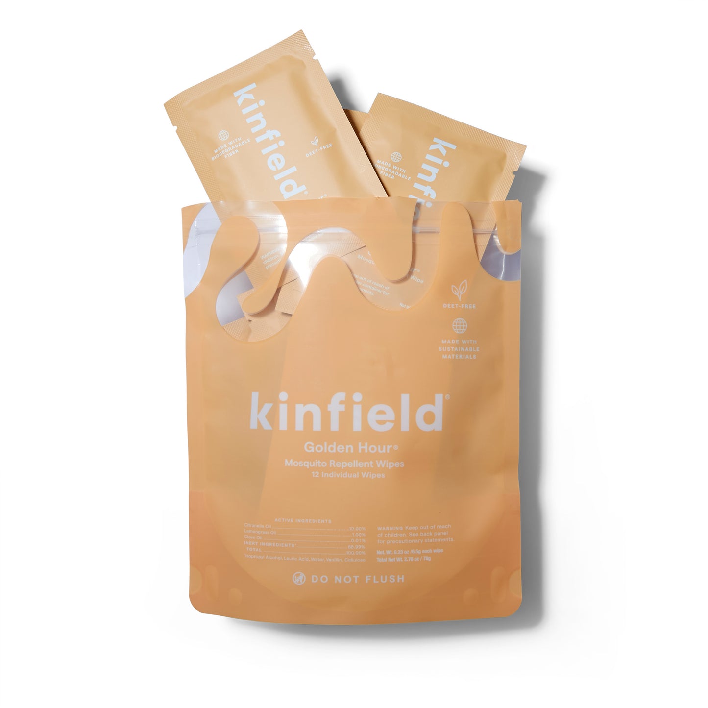Outer packaging of the Kinfield Golden Hour Mosquito Repellant Wipes. The package is opened with several of the individual sachets poking out of the package. 