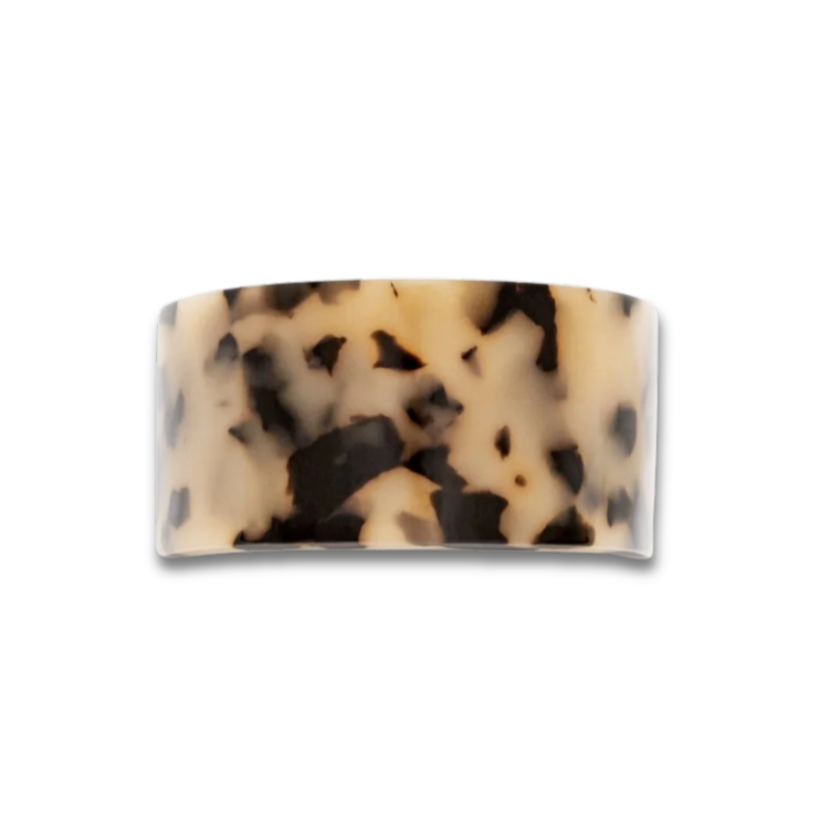 Tortoiseshell patterned hair clip on a white background