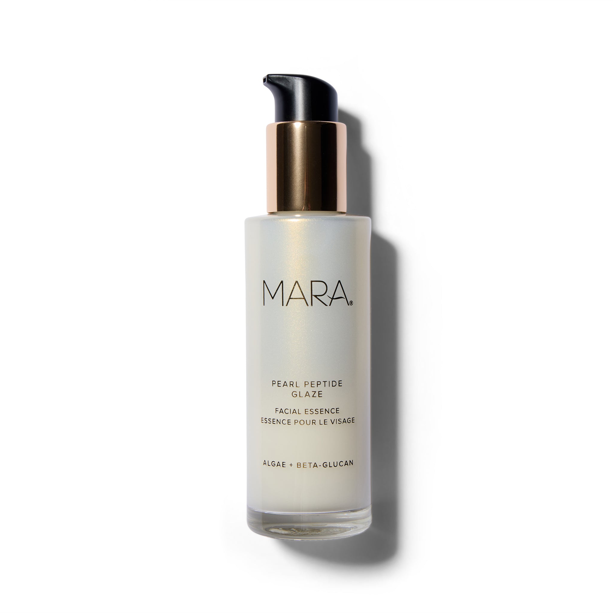 Pearly cosmetic bottle with black text and a gold and black cap.