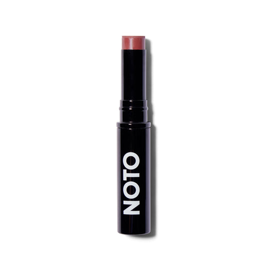 Front view of the Noto Organics Multibenne Stick in Five, a mauve-y rose shade. The cream blush is wound up out of the component so you can see that product. The component is black with a white logo. 