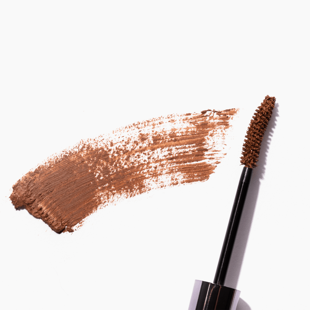 Swatch of the Redhead Revolution Gingerlash Mascara in Genuine Ginger with the wand next to it. 