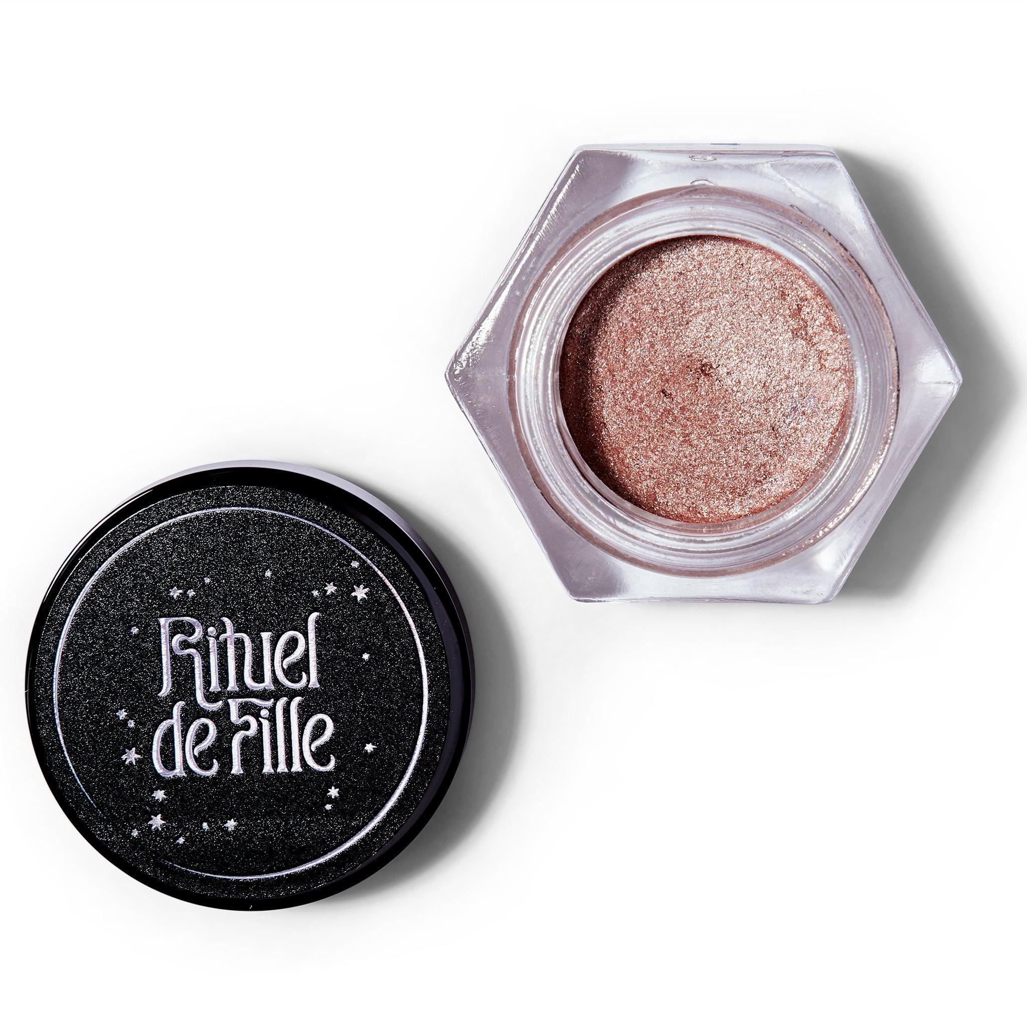 An open container of the Rituel De Fille Ash & Ember Eye Soot in Half Light. The cap is off and to the left. 