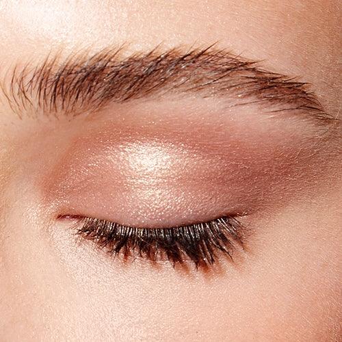 Image of a closed eye and fair skin wearing the Rituel de Fille Ash & Ember Eye Soot in Sigil. 