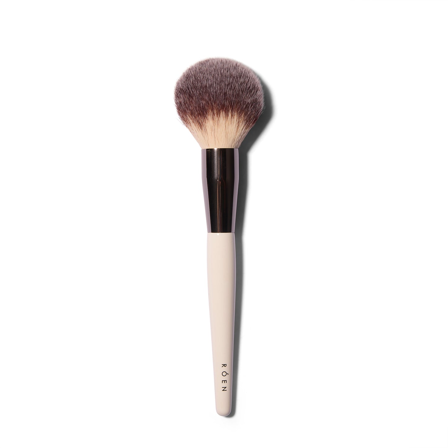 The large, fluffy Roen Everything Powder synthetic powder brush with a domed shape.