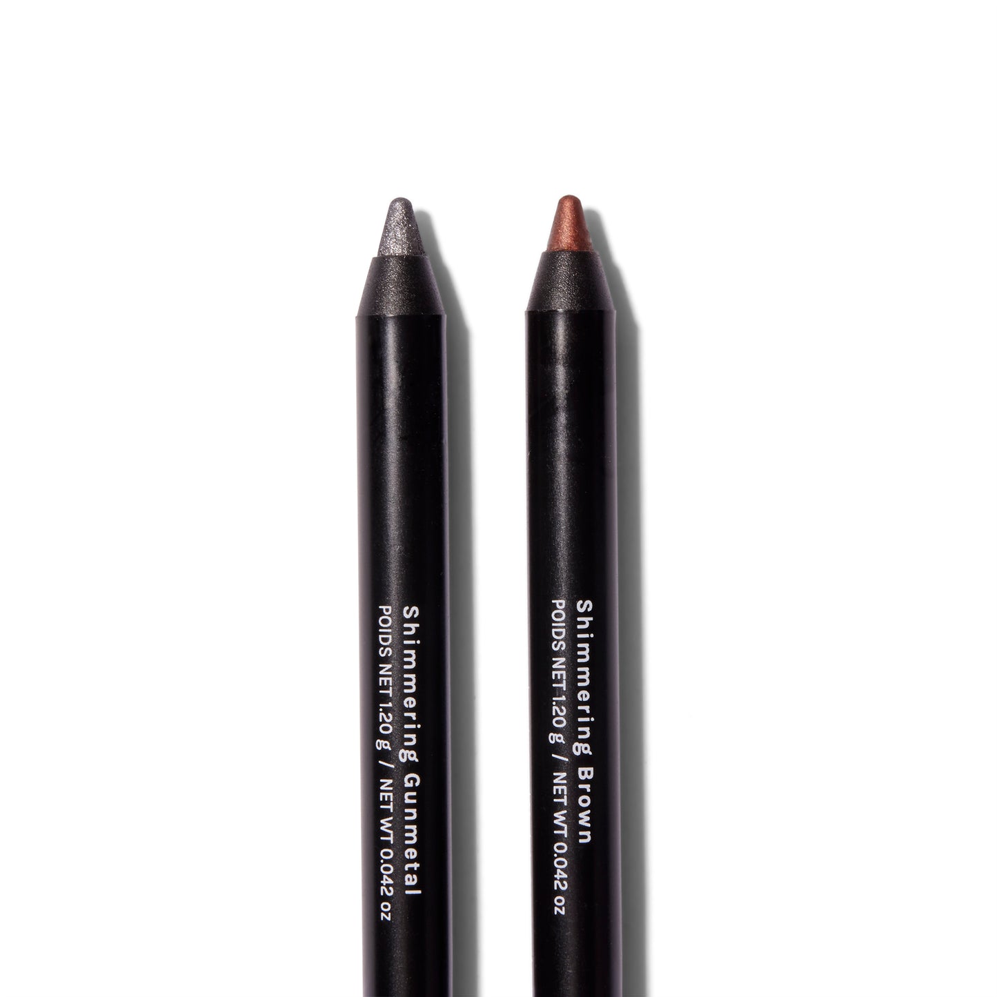 Close up of Roen Eyeline Define Eyeliners in Shimmering Gunmetal and Shimmering Brown. 