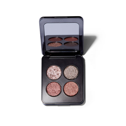 Open palette of the Roen Eyeshadow Palette in 11:11. The palette is open and the four metallic, bronze shades are also visible in the mirror.   