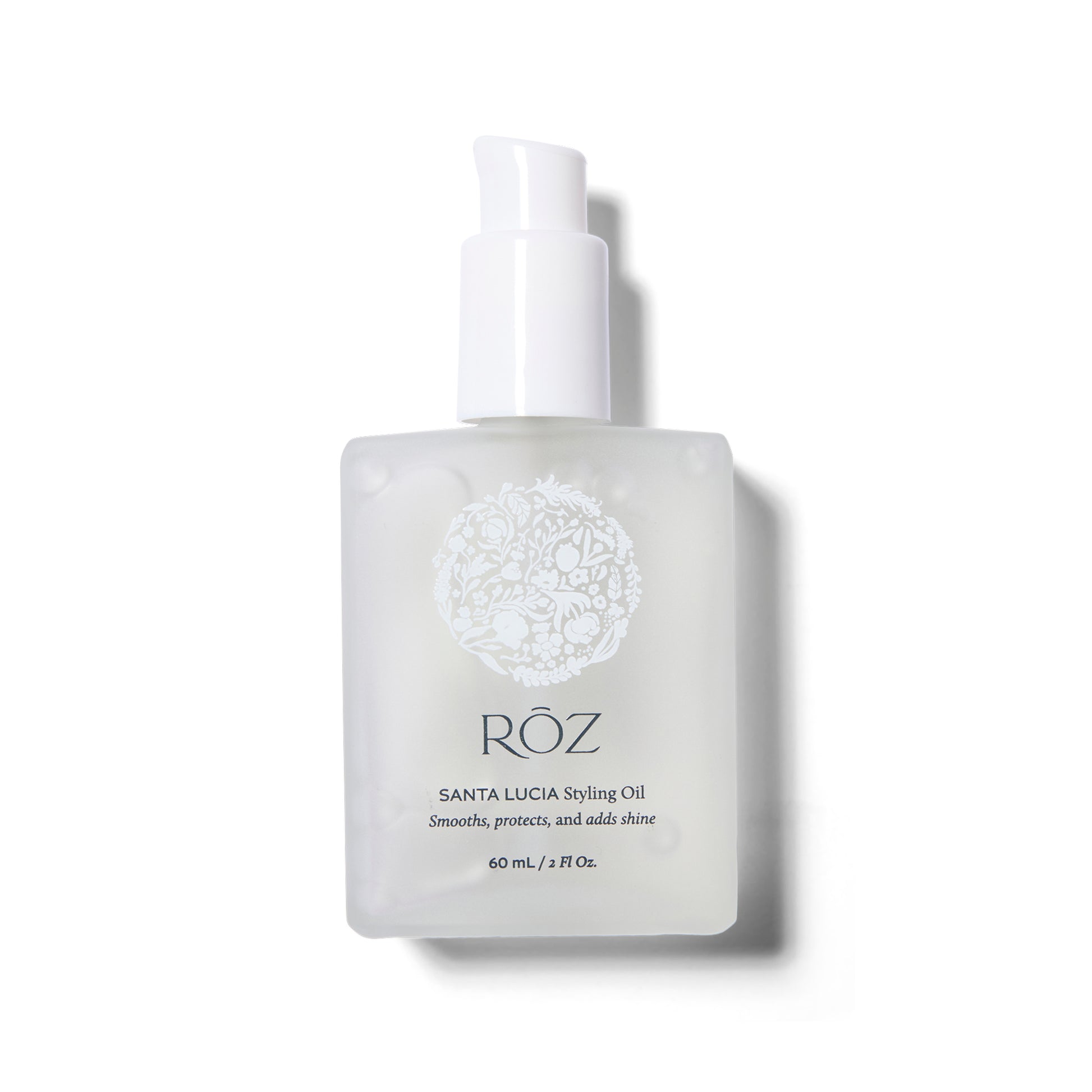 Front view of the ROZ Santa Lucia Styling Oil. The white frosted bottle is shown with the cap off. .