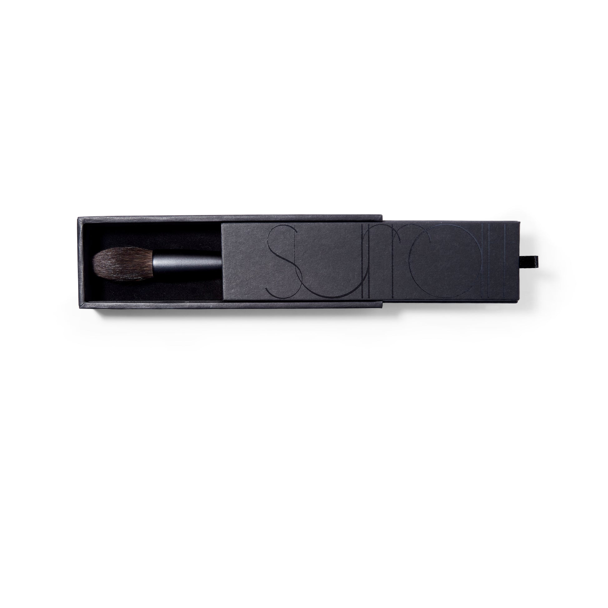 Surratt Artistique black handled makeup brush for blush or highlighter with natural bristles. Brush is tapered to a soft point. Brush is in a sturdy black box with velvet lining.