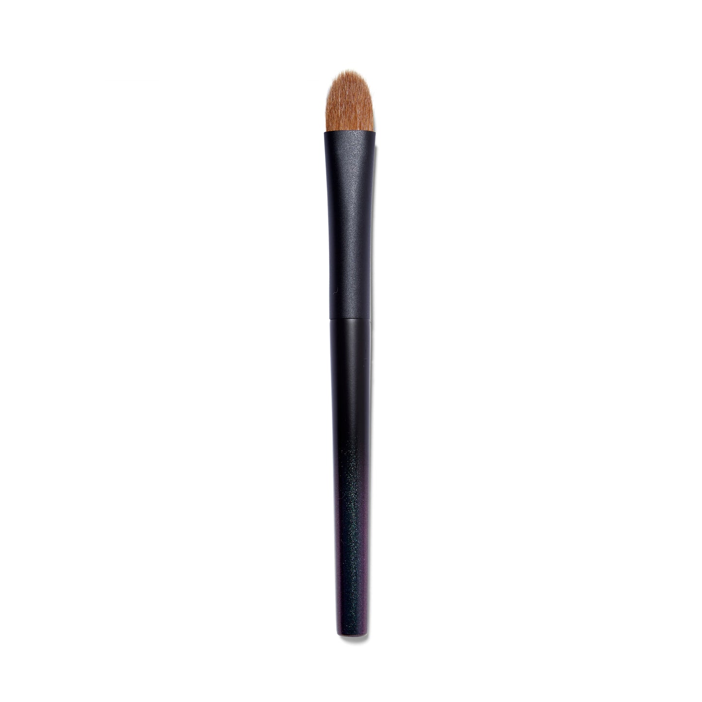 Full view of the Surratt Perfectionniste Complexion brush. The handle is black with subtle purple shimmer. The natural bristles are brown and in a soft curved taper. 