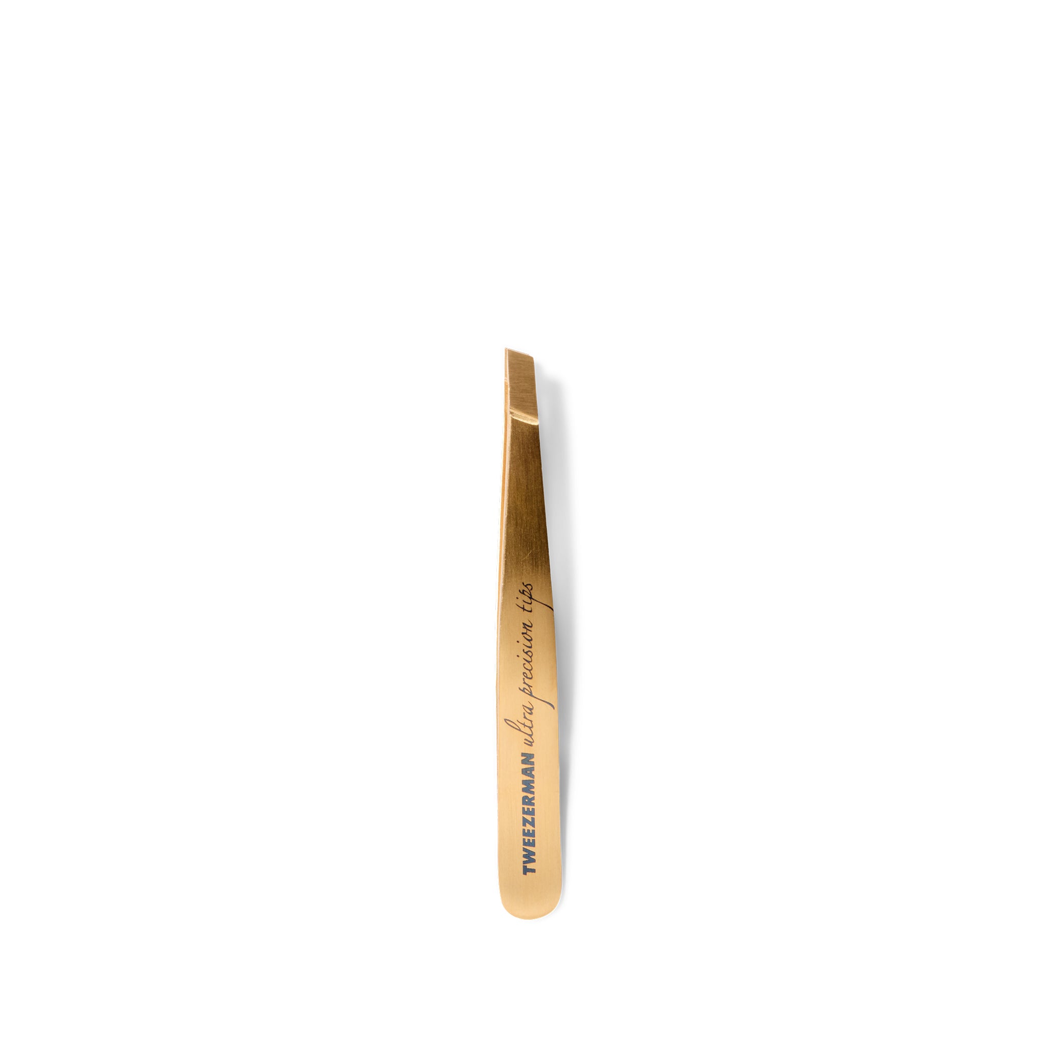 Gold-colored tweezers on a white background