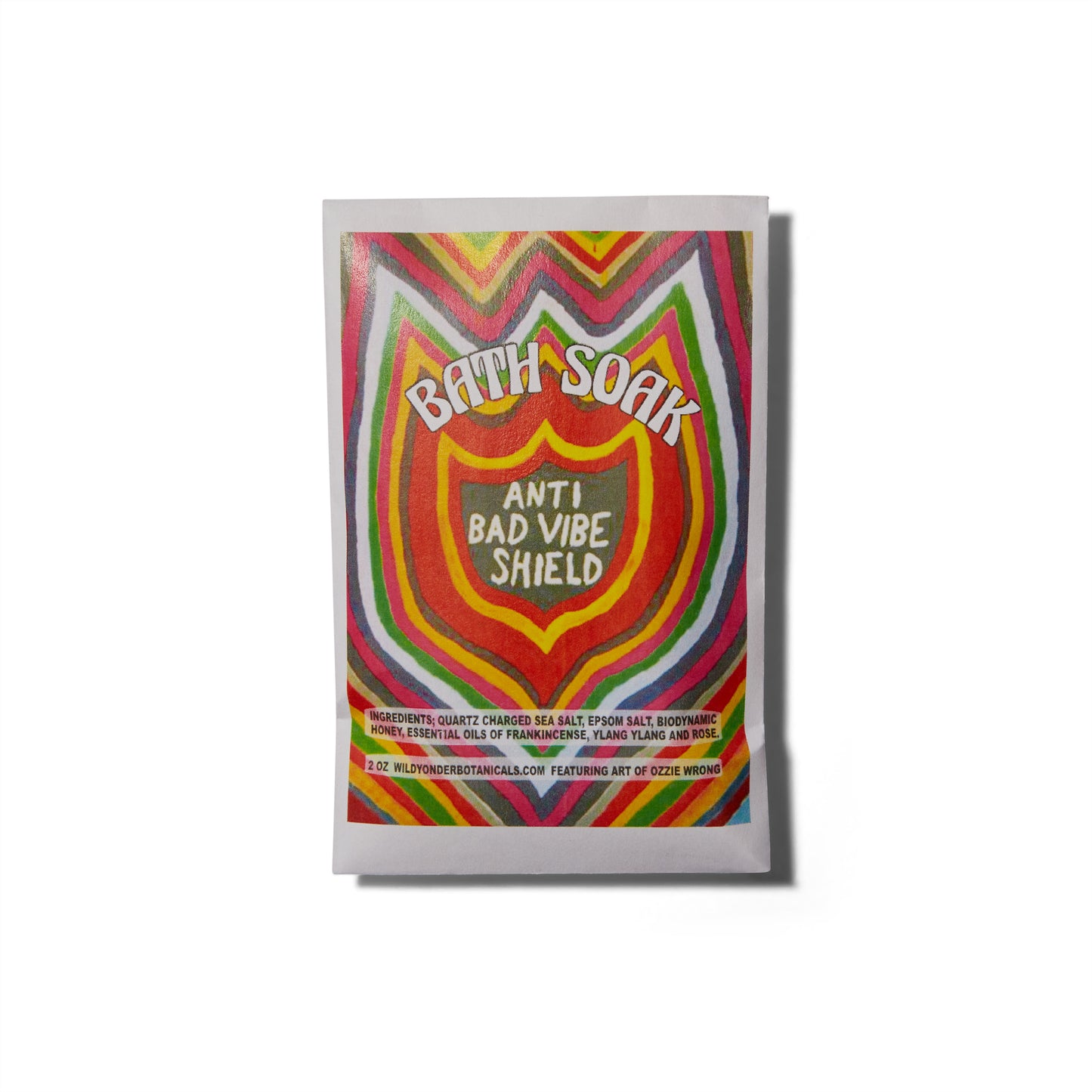 The Wild Yonder Bath Soak Salts in Anti Bad Vibe Shield. There is an illustration of a shield with rainbow stripes.