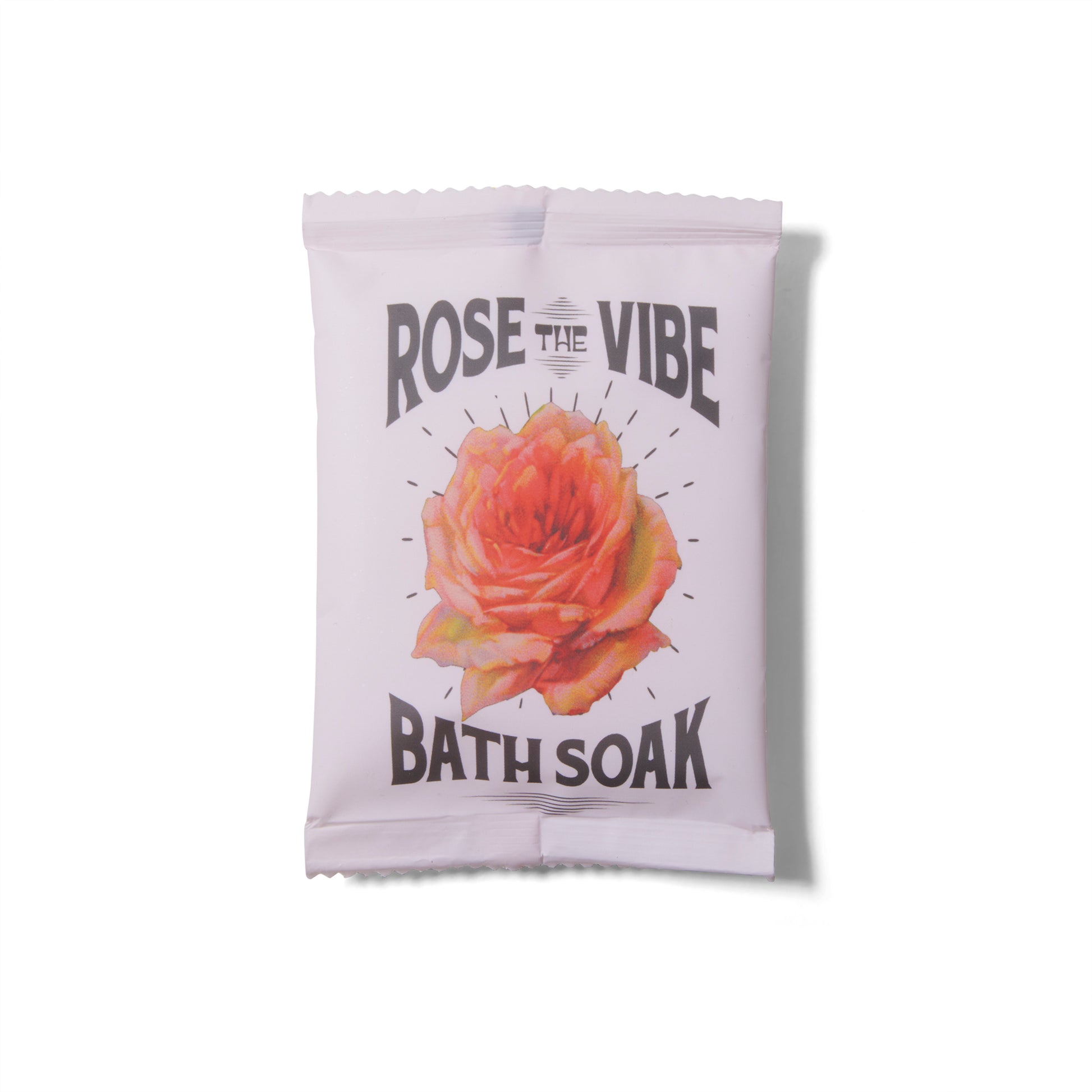 The Wild Yonder Bath Soak Salts in Rose the Vibe. There is an illustration of a rose on the package. 